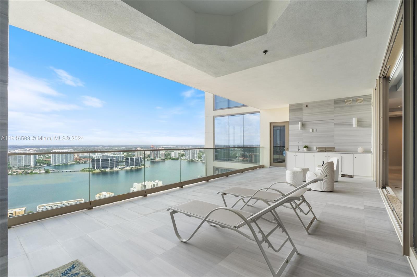 Stunning ultra-luxury modern residence at the Estates at Acqualina.  3 spacious bedrooms + den & 4.5 baths, 2,616 sq feet, high-end finishes & marble floors. State-of-the-art automation system: manages AV equipment, lighing, window shades, climate control & cameras. Master Suite w/sitting area, Italian built out closets,Miele beverage bar & sink; bathroom has dual sinks, large walk-in shower. Chef’s kitchen w/La Cornue gas range, wine refrigerator, marble backsplash & quartz countertops. Large terrace w/summer kitchen, jacuzzi, spectacular intracoastal & sunset views. 2 valet parking spaces. World-class amenities:5 restaurants, daily complimentary breakfast, Rolls Royce house car, 3 pools, fitness center, spa, cinema, golf simulators, bowling, soccer, basketball, skating rink, 2 dog parks.