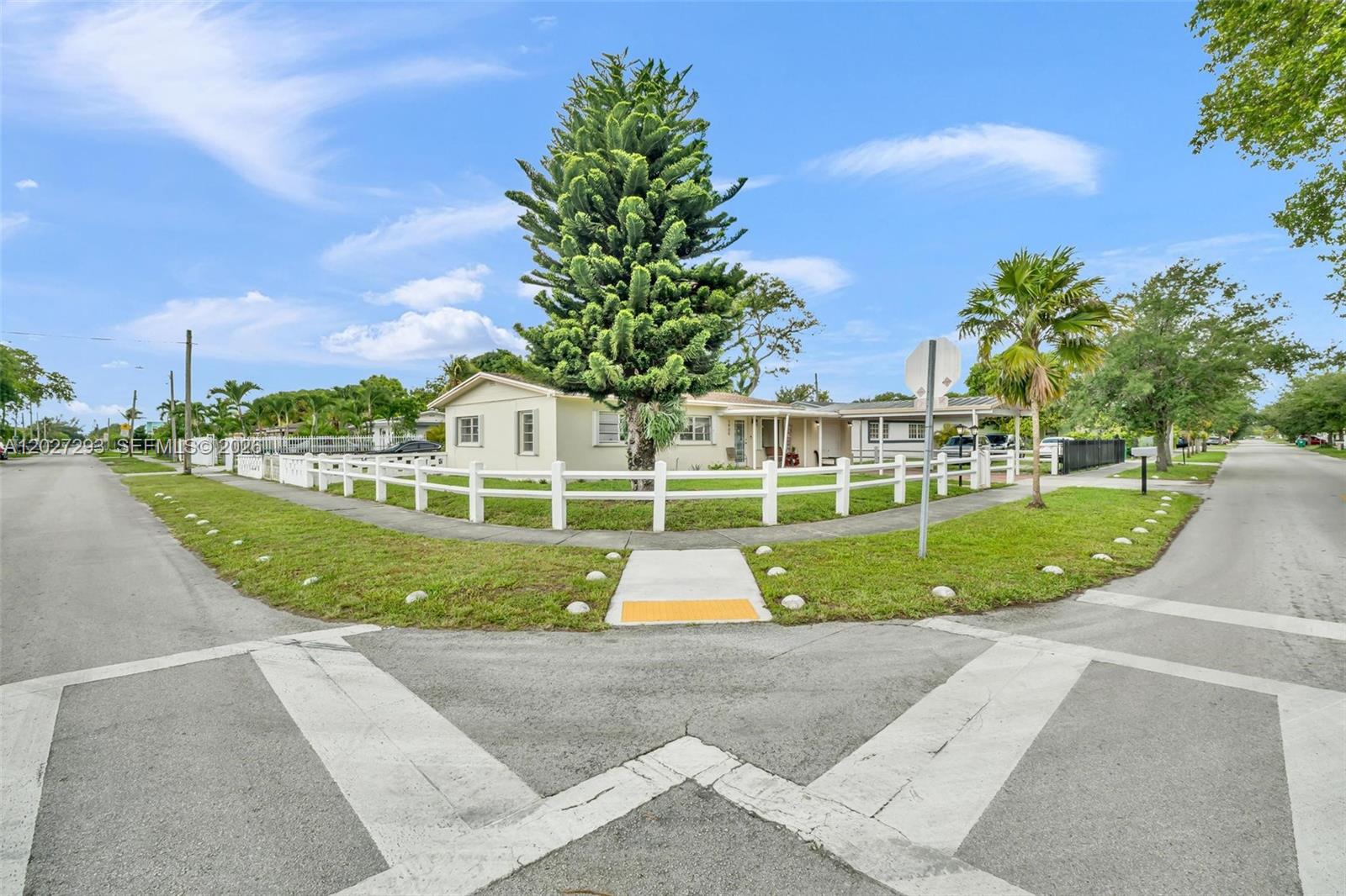 Beautifully maintained corner-lot home in North Miami offering comfort, functionality, and excellent curb appeal. This property features bright living spaces, updated flooring, and an inviting layout ideal for everyday living and entertaining. The kitchen boasts granite countertops, ample cabinetry, and generous workspace.

A spacious Florida room provides valuable additional living space and can be used as a family room, home office, playroom, or entertainment area. Large windows throughout the home allow for abundant natural light and create a warm, welcoming atmosphere. Property available for showings beginning Friday,  June 5th. 

Situated on a fenced oversized corner lot, the property offers plenty of outdoor space for gatherings, pets, gardening, or future enhancements. A covered carport and extended driveway provide ample parking.

Conveniently located near major highways, shopping, dining, schools, parks, and public transportation, this move-in-ready home presents an excellent opportunity for both homeowners and investors. Don't miss your chance to own this North Miami gem with versatile living space, a generous yard, and endless potential.
