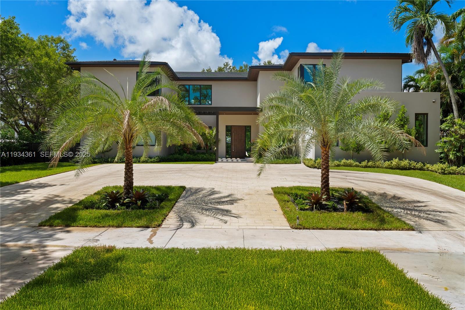 This exceptional modern luxury estate offers approximately 6,200 SF of open-concept living, showcasing striking contemporary architecture, soaring ceilings, and abundant natural light. Designed for both comfort and entertaining, the residence features expansive living and dining areas with seamless indoor-outdoor flow.
The home offers 9 spacious bedrooms, each with a private en-suite bathroom, plus 9.5 beautifully finished baths, providing privacy and flexibility for family and guests. High-end finishes and sleek modern design elements are found throughout, creating a refined yet inviting atmosphere. Floor-to-ceiling sliding glass doors open to a resort-style backyard featuring a large swimming pool, spa, turf lounging areas, and expansive terrace spaces ideal for dining and entertaining. Additional amenities include a private putting green and recreational areas, enhancing the home’s lifestyle appeal. Thoughtfully designed and built to impress, this modern sanctuary offers the perfect balance of luxury, functionality, and entertainment ideal for a primary residence, second home, or investment opportunity.