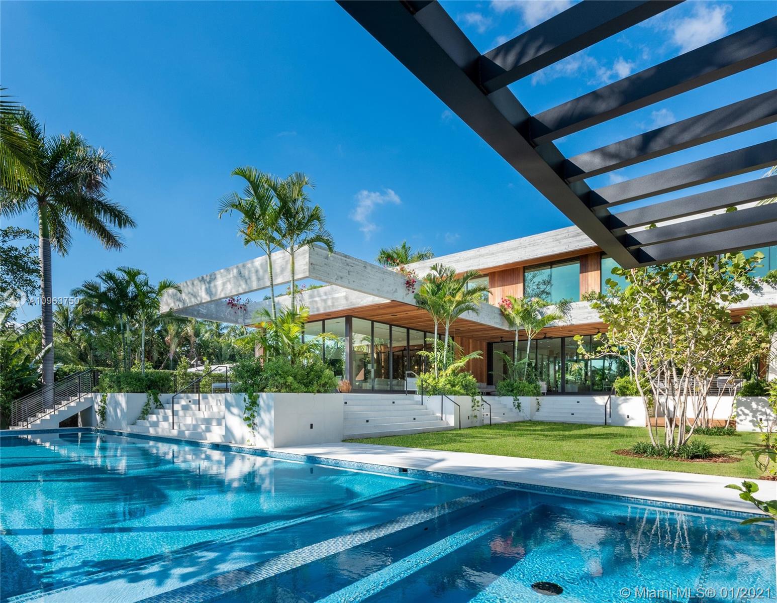 Extravagant brand-new mansion on gated Sunset Islands in Miami Beach with exceptional contemporary architecture by Kobi Karp, developed by Todd M. Glaser. Perfect for indoor-outdoor entertaining, this stunning home has the ideal southern exposure with 112 feet on the water and an extraordinary backyard with expansive covered areas, summer kitchen, and lawn area surrounding an 80-foot pool with a spa. Great open concept floor plan with soaring 12-FT ceilings, wood floors, chef’s kitchen by Italkraft, Crestron system, cove lighting, elevator, huge entertainment room with a wet bar. Five large bedrooms up, including a lavish master suite, a huge private deck, 2 mega-sized closets, & a dream bath. Staged by Artefacto. 3-car garage, 6-car carport, circular driveway.