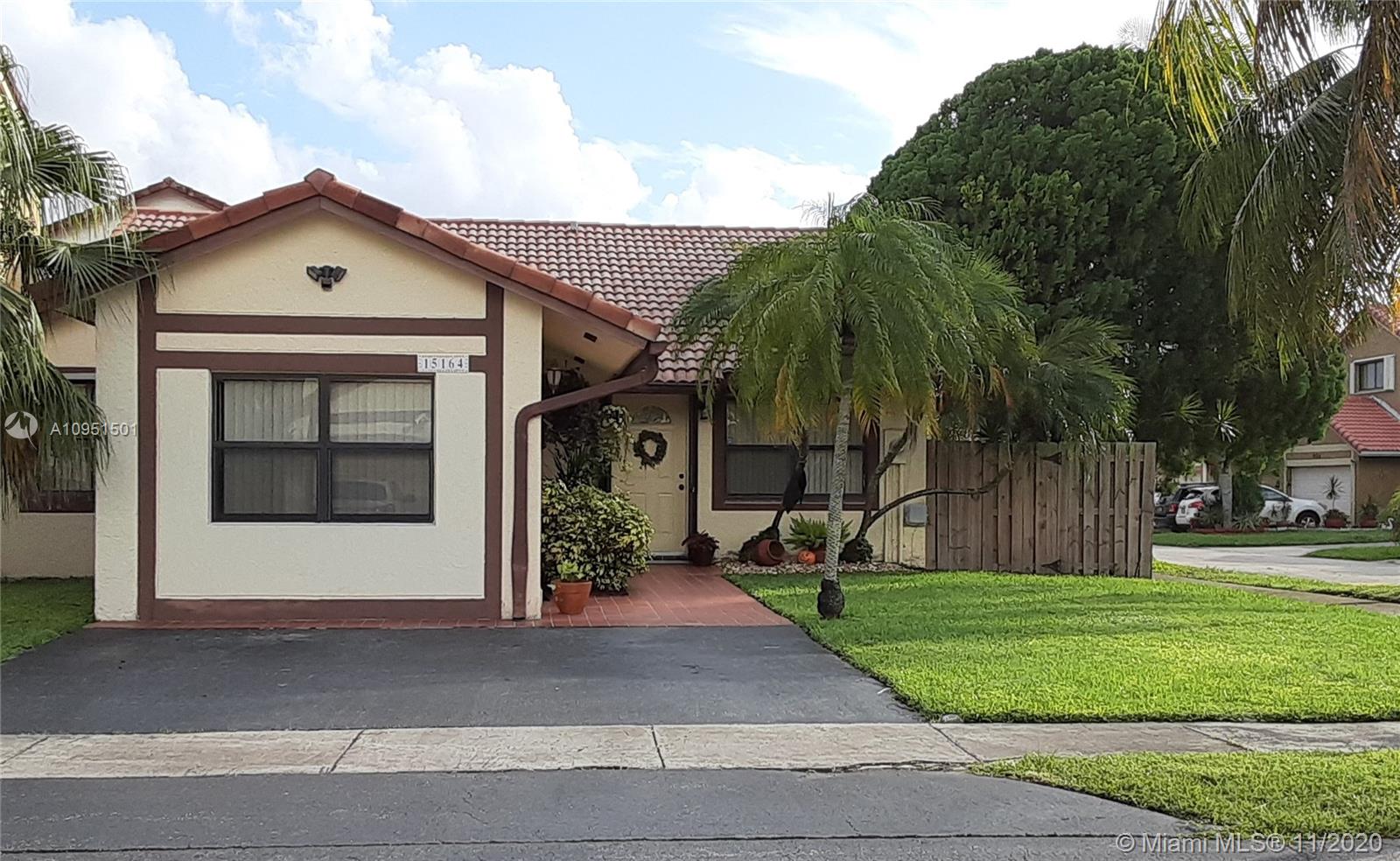 YOUR SEARCH STOPS NOW! This house in top shape condition is ready for moving-in. Beautiful 4/2, family room, newly remodeled kitchen with top of the line SS appliances, tall, modern, white, laminate cabinets. Enjoy family BBQ's and gatherings with friends in the ample, enclosed back porch with A/C and access to a cozy patio with pavers. Fourth bedroom with separate entrance may be in-laws quarters or home business office. One story, corner house, pretty landscape; some impact windows and storm panels. Tile floors in living area; wood laminate floors in bedrooms. Vacant, easy to show.