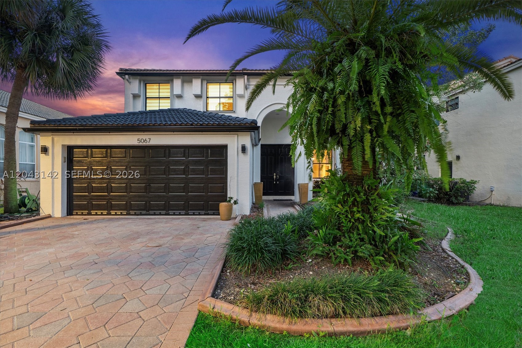 Beautifully maintained 4-bedroom, 2.5-bath home located in the sought-after gated community of Riviera Isles. Filled with natural light, this residence features an open-concept floor plan with spacious living and dining areas designed for comfortable everyday living and effortless entertaining. Step outside to your private backyard with a pool, perfect for enjoying South Florida's year-round lifestyle.

The converted garage offers flexible space that may be used as a home office, fitness room, media room, playroom, or hobby room. This area is not included in the bedroom count or living square footage and may be converted back to a garage if desired.

Residents of Riviera Isles enjoy access to a clubhouse, community pool, tennis and basketball courts, playgrounds, and scenic lakes throughout the neighborhood. Conveniently located near shopping, dining, parks, schools, and major roadways, this home offers an exceptional combination of comfort, versatility, and community living.