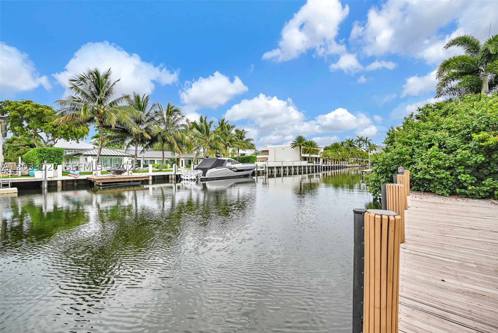 Seven Isles waterfront living in prime Las Olas. This custom 3-bedroom, 2-bath residence with a flexible den/office offers a rare opportunity to enjoy, renovate, or redevelop in one of Fort Lauderdale’s most desirable waterfront neighborhoods. Set on 75 feet of canal frontage, the property delivers the lifestyle buyers seek: morning coffee by the water, sunset gatherings by the heated infinity pool, and effortless boating from a private dock that accommodates up to a 75-foot vessel. Beyond the home itself, the true value is in the land, location, and future potential, with the possibility to build additional square footage and create a larger luxury residence tailored to today’s market. The area is seeing significant new construction, bringing fresh architectural value and elevating the long-term appeal of Seven Isles. Tucked behind a gated tropical garden, the home features cathedral beamed ceilings, carved teak doors, concrete and Ipe wood floors, and floor-to-ceiling glass overlooking the pool, dock, and lush grounds. The European kitchen includes custom cabinetry, premium appliances, Bertazzoni six-burner gas range, and a large island. Outdoor living is complete with a summer kitchen, fruit trees, wide dock, and serene canal views. Updated roof, electric, plumbing, and HVAC enhance the offering. A unique waterfront property where land value, lifestyle, boating, and redevelopment potential come together in an exceptional Las Olas location.