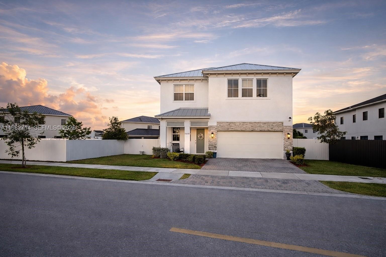 Rare opportunity to own a modern construction 5 Bedroom home designed for flexibility, comfort, and privacy —Two Homes in One featuring a private Next-Gen / In-Law Suite with Private Entrance, no HOA, no CDD. Located in a quiet residential neighborhood, this beautifully designed, spacious living, and multigenerational flexibility.
One of the home’s most valuable features is the private Flex-Gen / In-Law Suite with its own independent entrance. Complete with a living area, kitchen, and bedroom, it offers a fully functional private space ideal for extended family, guests, or potential rental income — truly offering the convenience of two homes in one. 
Inside the main residence, you'll find 5 Spacious Bedrooms, High Ceilings, and elegant extra-large porcelain tile flooring that create a bright, modern, and sophisticated atmosphere. The open layout allows natural light to flow throughout the home, making every space feel welcoming and comfortable. Upstairs, a large loft adds incredible flexibility, perfect for a media room, home office, playroom, or second family room. 
Built for both beauty and peace of mind, the home includes impact windows and quality modern construction. Step outside to a spacious backyard with endless possibilities — with plenty of room to design your dream outdoor retreat with a future pool, cabana, outdoor kitchen, or entertainment area.
The property also offers extra gated parking, ideal for multiple vehicles, boats, or recreational equipment.