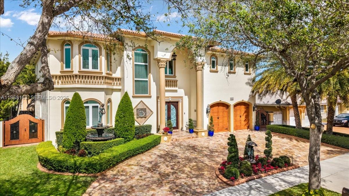 Luxurious estate located within the gated and highly sought-after community of Royal Oaks. This Mediterranean-inspired home offers approximately 4,256 square feet of thoughtfully designed living space, featuring six bedrooms and five bathrooms.
Built entirely of concrete, including the second floor, the residence provides exceptional durability and long-term value. A marble entry with a custom medallion leads into spacious interiors with high ceilings, classic architectural details, and marble flooring throughout, creating a bright and elegant atmosphere.
The functional layout includes three guest bedrooms with private en-suite baths and an expansive primary suite of over 900 square feet, complete with a spa-style bathroom and Jacuzzi soaking tub. High-impact windows and doors enhance security and energy efficiency. A second-floor kitchenette with washer and dryer is ideal for extended family or guests, and an oversized two-car garage with marble flooring completes the home’s interior.
The backyard oasis is equally impressive, featuring a marble deck, large covered terrace, refreshing pool area, outdoor kitchen, and a tiki hut—perfect for entertaining or relaxing in privacy.