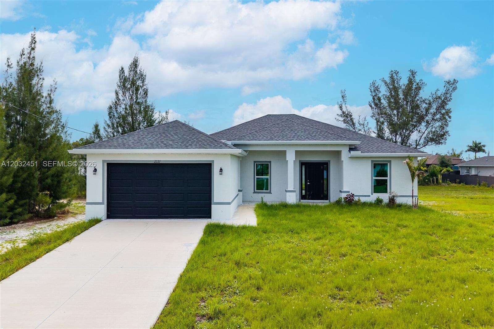 NEW CONSTRUCTION WITH IMPACT WINDOWS IN NW CAPE CORAL! Welcome to this beautifully designed new construction home offering 4 bedrooms, 3 full bathrooms, and an open-concept floor plan that blends modern style with everyday functionality. The spacious kitchen features quartz countertops, stylish cabinetry, stainless steel appliances, and a large island overlooking the living and dining areas, creating the perfect space for entertaining and daily living. High ceilings and abundant natural light enhance the home's bright and welcoming atmosphere. The private owner's suite serves as a relaxing retreat with a walk-in closet and beautifully appointed en-suite bath. One of the secondary bedrooms also features its own private en-suite bathroom—an exceptional feature that provides added comfort and privacy for guests, extended family, or multi-generational living. Two additional bedrooms share convenient access to the third full bathroom. Built with hurricane-impact windows, this home offers added storm protection, energy efficiency, and peace of mind year-round. Situated on a generously sized homesite in the growing Northwest Cape Coral area, there is plenty of room to create your dream outdoor living space, including a future pool. Conveniently located near shopping, dining, boating, golf, and all that Southwest Florida has to offer, this home combines quality construction, thoughtful design, and modern comfort. Why wait to build when you can move into a brand-new home today?