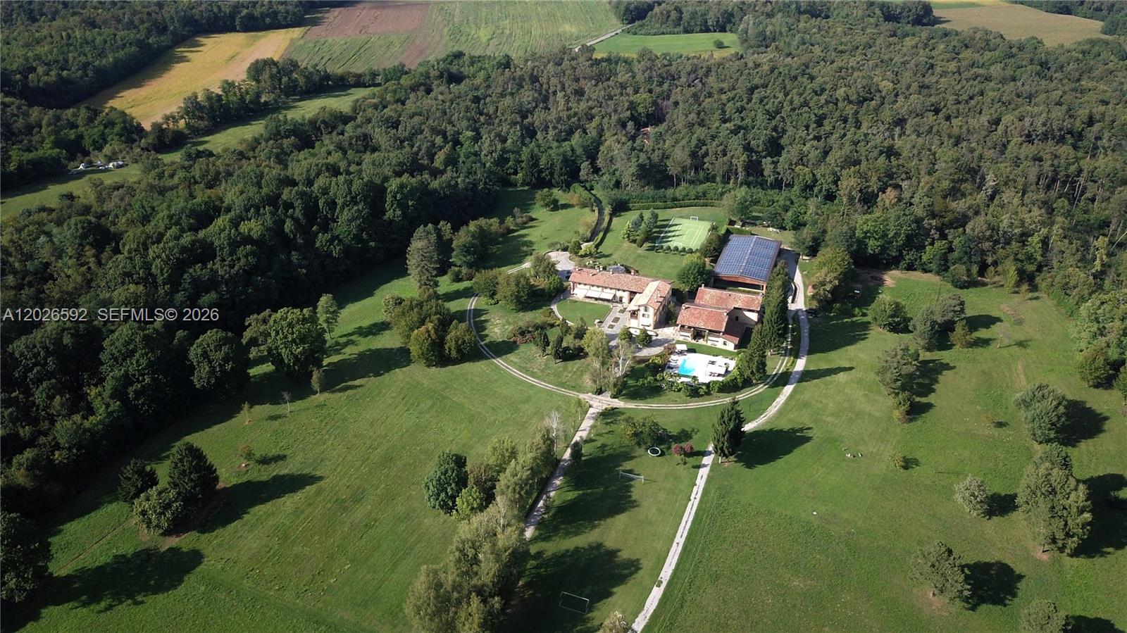 Rare one-of-a-kind luxury estate set on approximately 86.5 private acres (35 hectares)20 hectares fully fenced and beautifully maintained. The property offers 32,000 SF of interior living space across multiple residential structures created through an extraordinary restoration of historic rural buildings completed between 1998 and 2000 while preserving the original architectural character.
The main residence features grand reception areas formal dining rooms lounges library gourmet kitchen exec offices primary and guest suites 8 marble/travertine bathrooms with Jacuzzi tubs Interiors showcase antique oak boiserie reclaimed terracotta flooring fine hardwood floors elegant Italian finishes throughout
Luxury wellness entertainment amenities include wine cellar fireplace fully equipped gym massage room SPA with sauna Turkish bath chromotherapy advanced climate control security systems surveillance cameras. Additional structures include a spectacular Club House converted from historic stables with grand entertaining salon, fireplace bar game areas billiards room guest residences, staff housing, horse stables, covered paddock, large garage area, and extensive photovoltaic energy systems.
Outdoor amenities include a resort-style pool with teak deck, tennis court, soccer field, English gardens, wooded areas, walking paths, and a dramatic 600-meter tree-lined entrance drive. Exceptional opportunity for private residence, luxury retreat, equestrian estate, or hospitality conversion.