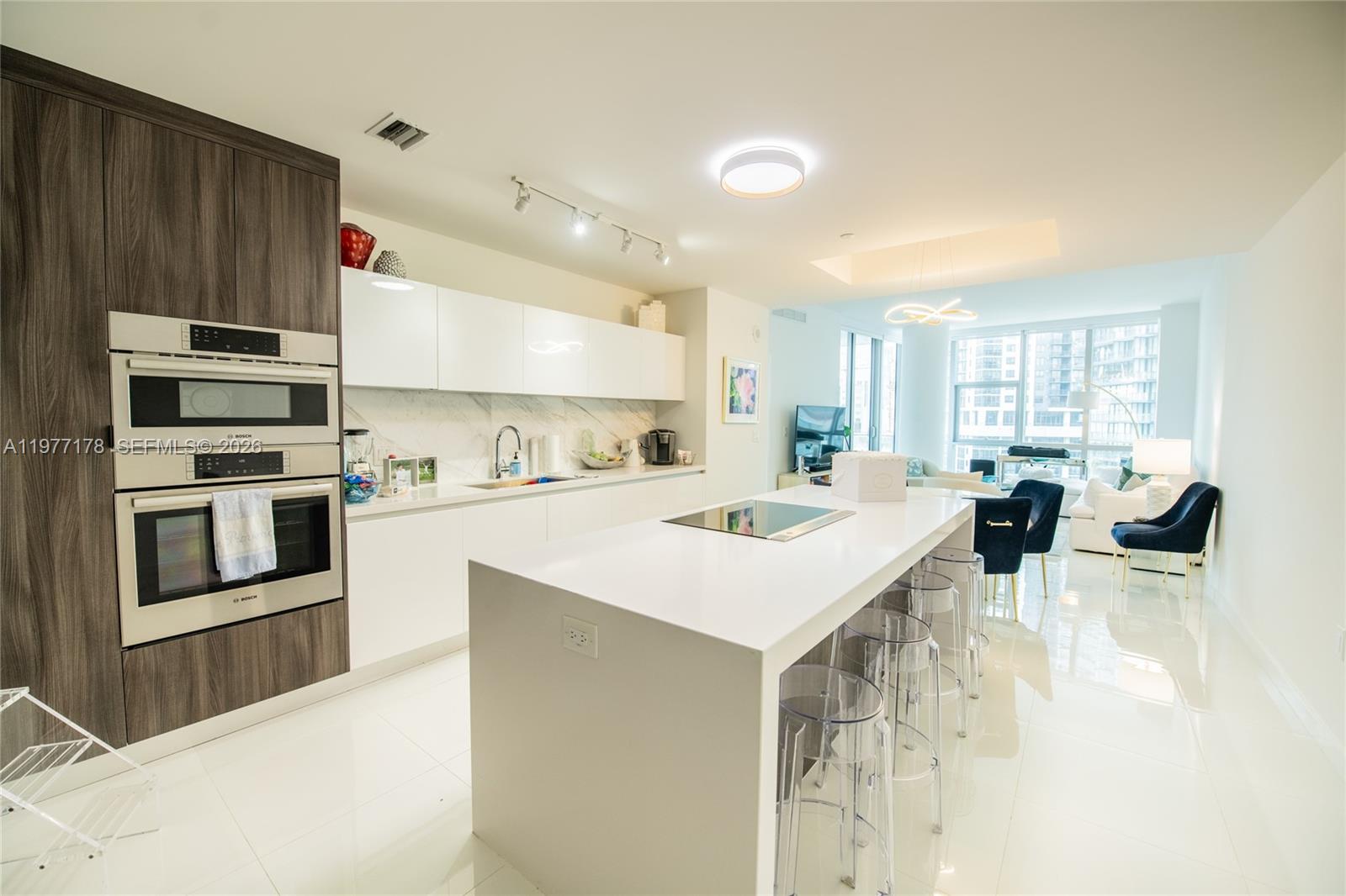 This spacious and luxurious condo at Paramount Miami World Center has it all. The residence boasts porcelain flooring throughout, luxurious bathrooms with marble flooring, an Italian kitchen with Bosch appliances + Subzero fridge, built out closets and an expansive balcony. Paramount offers 46 different amenities such as 5 pools, spa, outdoor lounge, summer kitchen, game room, state of the art fitness center, boxing studio, basketball court, racquetball, yoga, observatory, jam room and recording studio + much more! Located within the Miami World Center, the second largest master planned community in the U.S., Paramount is only 10 minutes to Brickell City Center, 5 minutes to the Design District, 10 minutes to South Beach and walking distance to the Adrienne Arsht performing arts center.