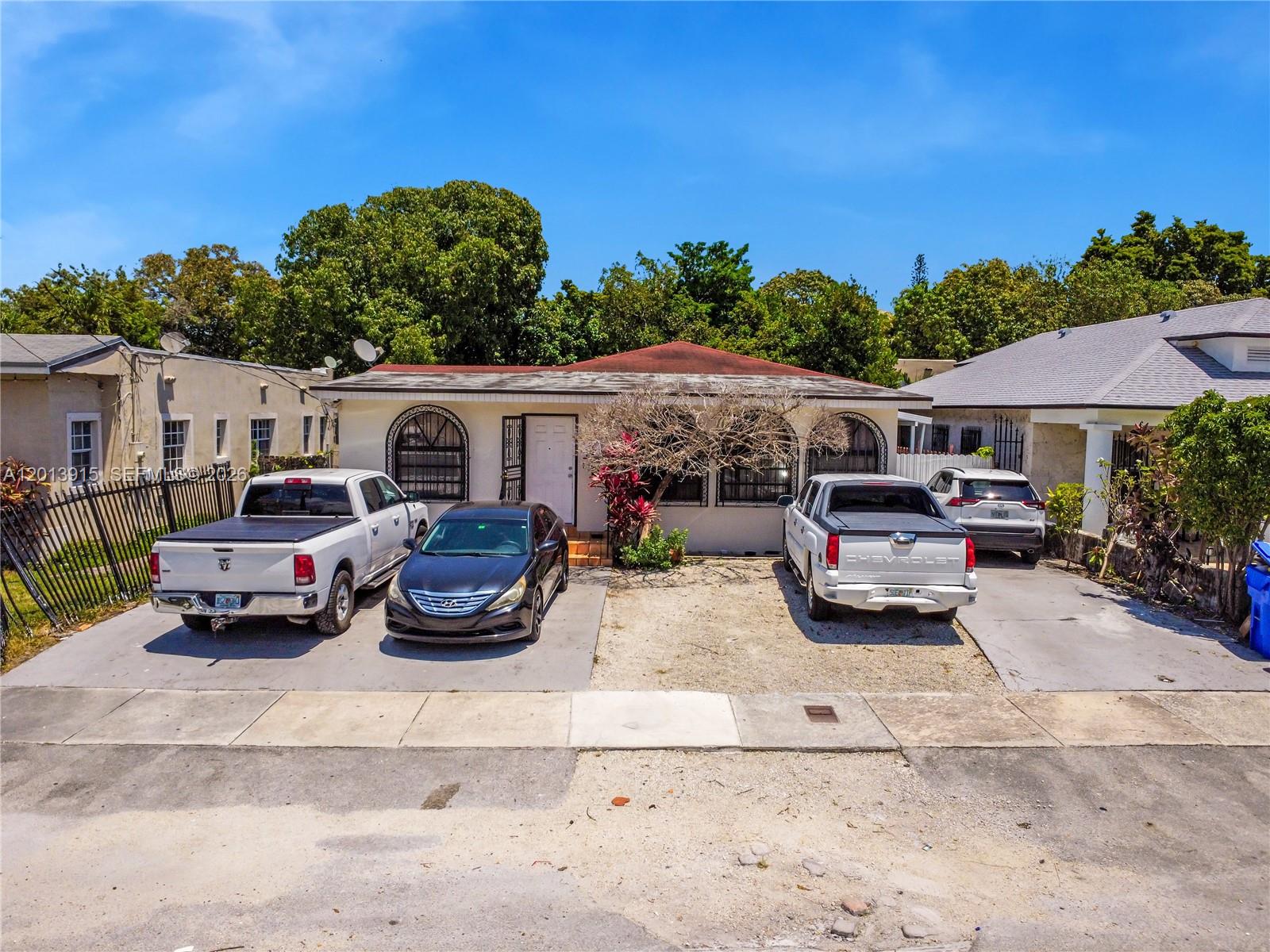 Exceptional opportunity! Single-family home operating as a triplex, ideal for investors or end-users seeking additional income. Unit #1 features 4 bed/2 bath, updated kitchen with granite countertops, central A/C, washer and dryer, and patio. Unit #2 offers 2 bed/1 bath with a spacious kitchen, central A/C, washer and dryer, and patio. Unit #3 is a detached cottage-style unit with 1 bedroom and 1 bath, perfect for guests or rental. Property is on one meter, with owner currently paying all utilities. Ample parking for 5+ vehicles in front. Flexible layout is perfect for multi-generational living or income-producing use. Centrally located near major expressways, shopping, and dining.