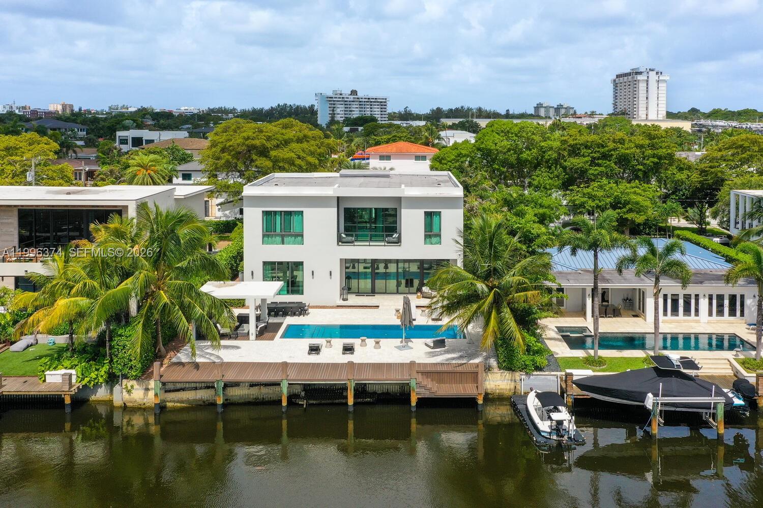 Welcome to "Casa Coronado", where luxury meets the serene beauty of waterfront living in the prestigious Keystone Point community. This contemporary masterpiece features 8 bedrooms and 8.5 bathrooms, seamlessly blending refined interiors with opulent indoor and outdoor living spaces. The residence boasts a 75-foot dock and a private elevator, encapsulating comfort and sophistication. The open floor plan, accentuated by 12-foot ceilings, radiates elegance and style. Indulge in the exquisite lap pool, relax in the gazebo with BBQ, and enjoy the gourmet chef’s kitchen equipped with a gas stovetop. Each room is thoughtfully designed with a safe box, built in closets space. Conveniently located just 10 minutes from Bal Harbour Shops and 30 minutes from both MIA and FLL.