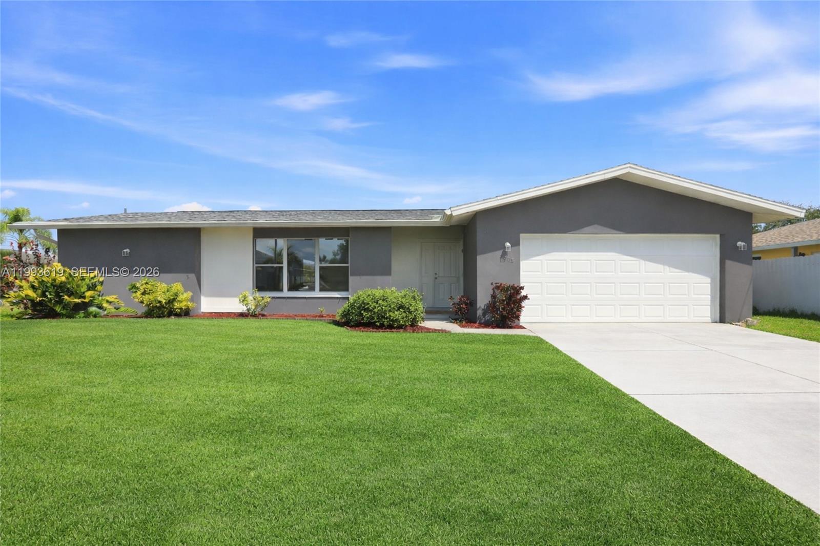 Welcome to 3805 SE 12th Ave - a beautifully renovated 3-bedroom, 3-bathroom home that sits on 0.3 acres corner lot in one of Cape Coral's most desirable neighborhoods. The property features a complete interior renovation with an open-concept living area that welcomes abundant natural light. A remodeled kitchen anchors the space with a large quartz countertop island, new appliances, fresh interior paint and updated light fixtures, while porcelain tile flooring extends throughout the entire home. All three bathrooms have been thoughtfully remodeled, and a 2-car garage provides ample storage and convenience. The fully fenced yard offers pleasant canal views and enough space to add a pool. Practical advantages include a new roof, city water, all assessments paid, and no flood insurance required, which translates to meaningful annual savings for the homeowner. The location provides easy access to Downtown Cape Coral, Yacht Club Public Beach, and the Cape Coral Bridge connecting to Fort Myers. Waterfront dining, shopping, and the relaxed Southwest Florida lifestyle are all just minutes away.