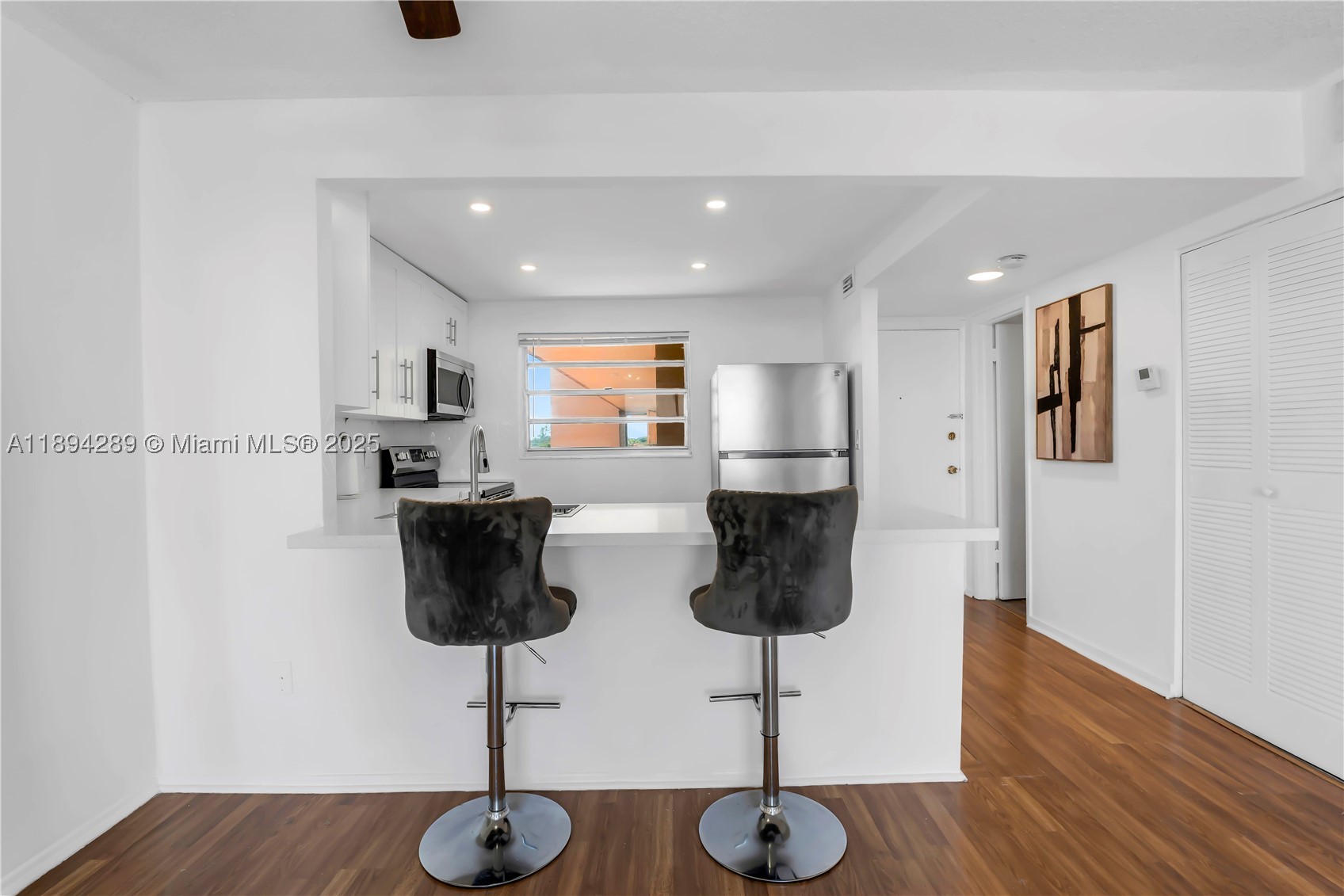 No assessments and 50-year certification passed! This completely renovated condo combines modern style, comfort, and incredible city views all in one. The open layout fills the space with natural light, showcasing brand-new finishes throughout, including updated flooring, a sleek kitchen, and a beautifully redone bathroom. The building is exceptionally maintained, featuring a newer roof (7 years old) and new washers and dryers on every floor. With a low monthly maintenance fee and an unbeatable location just minutes from shopping, dining, parks, and major highways, this home offers both convenience and peace of mind. Perfect for investors or anyone seeking a move-in-ready condo in a prime area.