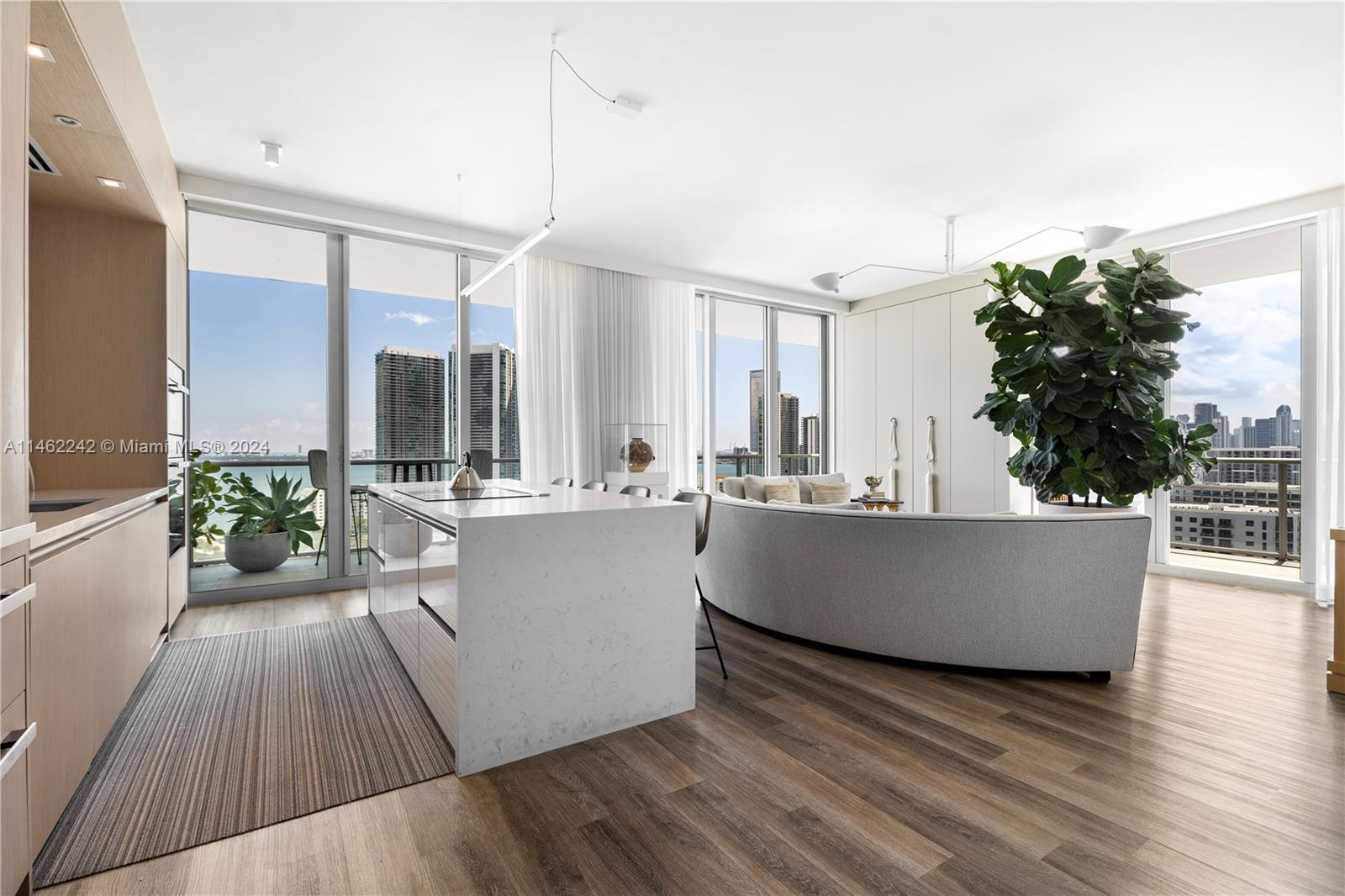 Welcome to vibrant Midtown Miami & this exquisite corner residence at 2 Midtown. This fully-furnished & turnkey home features designer customizations throughout. Ensuite bedrooms, with Samsung The Frame TVs & walk-in closets, have direct access to the wrap-around balcony which is furnished & accessorized with gorgeous greenery. Entertain indoors in an open living space with Sonos speakers in every room & outdoors while enjoying breathtaking water & city views. Unit comes with 1 parking space, power shades & Control4 system. This pet-friendly building also offers a pool, hot tub, sauna, steam room, 24hr concierge & internet service is included. Easy access to I-95 & the causeway leading to the beaches, within steps of a large park, restaurants, the Miami Design District & Wynwood.