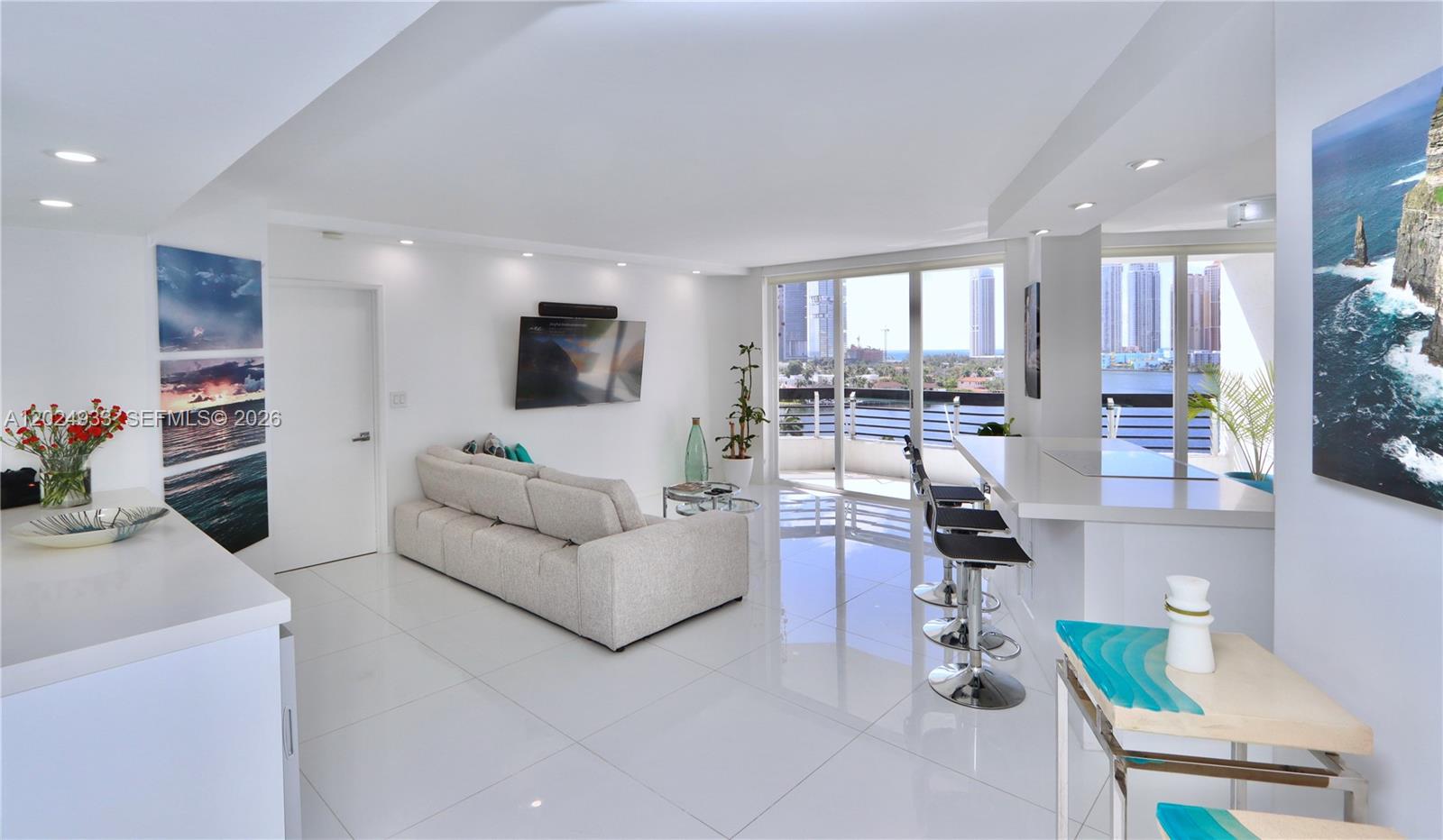 Amazing opportunity to own a spectacular 1BR/1.5BA condo featuring breathtaking panoramic views of the Intracoastal and ocean, filled with abundant natural light and ideally located in the heart of Aventura. This recently remodeled residence located on the 11 floor, offers an open-concept kitchen with stunning water views, a spacious primary bedroom overlooking the water, and a beautifully designed bathroom with dual sinks, a separate bathtub, and walk-in shower and walking closet. Offered furnished for your convenience. In-unit washer and dryer included. It comes with one covered parking.
Come experience the exceptional lifestyle that Mystic Pointe has to offer! Enjoy resort-style living with an impressive array of amenities, including a state-of-the-art fitness center, heated pool, Jacuzzi, sauna, game room, library, 7 clay tennis courts, 2 pickleball courts, basketball court, children’s playground, 2 dog parks, 1 convenience shop and 1 restaurant and electric vehicle charging stations. Mystic Pointe is a highly desirable, gated, full-service community with Valet and 24/7 concierge service, ideally located near fine dining, beaches, Aventura Mall, and houses of worship. Easy to show — call listing agent for a private showing.