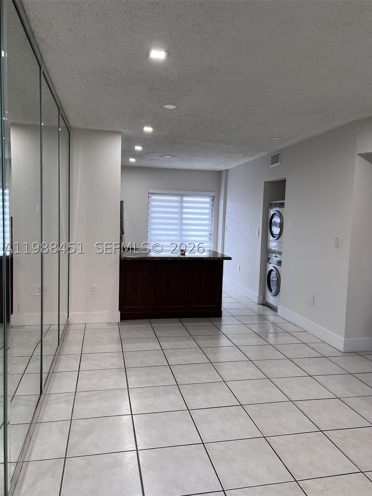 Beautiful 2-bedroom, 2-bathroom condo featuring a granite kitchen with modern finishes and updated bathrooms with upgraded fixtures throughout. This well-maintained unit includes a washer and dryer for added convenience, one assigned parking space, and is located in a building with elevator access. Perfect for comfortable living or investment, in a desirable and centrally located community.