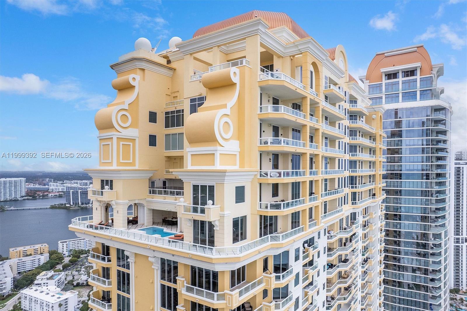 Exceptional penthouse at the award winning Acqualina Resort & Residences is one of Miami’s premier private residences, combining scale, design, and an unbeatable oceanfront location with the resort’s five-star service, dining, and private beach access. The home offers 6.5 bathrooms and 4 bedroom + maids quarters, 6,419 sqft of interior living space and over 2800 sqft outdoors, complete with a outdoor pool and summer kitchen that seamlessly extend the living and entertaining areas. Designed by Italian brand Turri, the residence takes inspiration from 1920s Renaissance style, with refined, timeless detailing throughout. Highlights include ceilings and ornamental work by JP Weaver, hand-finished Carrara marble columns, and bathrooms finished in book-matched onyx with Lalique crystal inlays and Sherle Wagner fixtures. The custom Neff kitchen is fitted with Miele, Sub-Zero, and Wolf appliances, balancing clean design with top-tier performance. Large terraces and open living spaces showcase sweeping views of the ocean and Intracoastal, making the home well-suited for both everyday living and entertaining on a grand scale.
