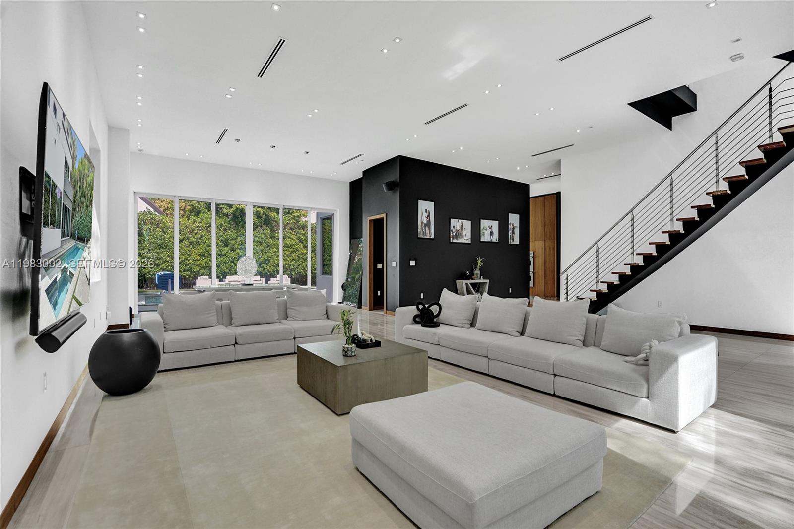 Fully rebuilt and meticulously renovated in 2017, this extraordinary 6BD/6.5BA estate in a prestigious gated North Miami Beach community offers the look, feel, and quality of new construction—truly a home that has it all. Designed for elevated modern living, with double-high ceilings throughout the house, 24*36 marble floors. Expansive light-filled interiors, and a spectacular chef’s kitchen with marble countertops, Sub-Zero appliances, gas range, and sleek custom cabinetry.
All 6 bedrooms feature en-suite baths, including a stunning primary suite with a private balcony overlooking a tranquil backyard oasis, plus a dedicated office. Thoughtfully designed for both comfort and entertaining, the home offers multiple living areas, upstairs and downstairs family rooms, maid’s quarters, laundry room, garage, and a whole-home water filtration system.
Step outside to your private resort-style retreat with a heated saltwater pool surrounded by lush, manicured landscaping—perfect for unforgettable gatherings or serene everyday living. Community amenities include playground, tennis & basketball courts and pavillon.
Ideally located just minutes from the beach, Aventura Mall, top-rated schools, and major highways. A rare opportunity to own a like-new luxury residence in one of North Miami’s most sought-after gated communities.