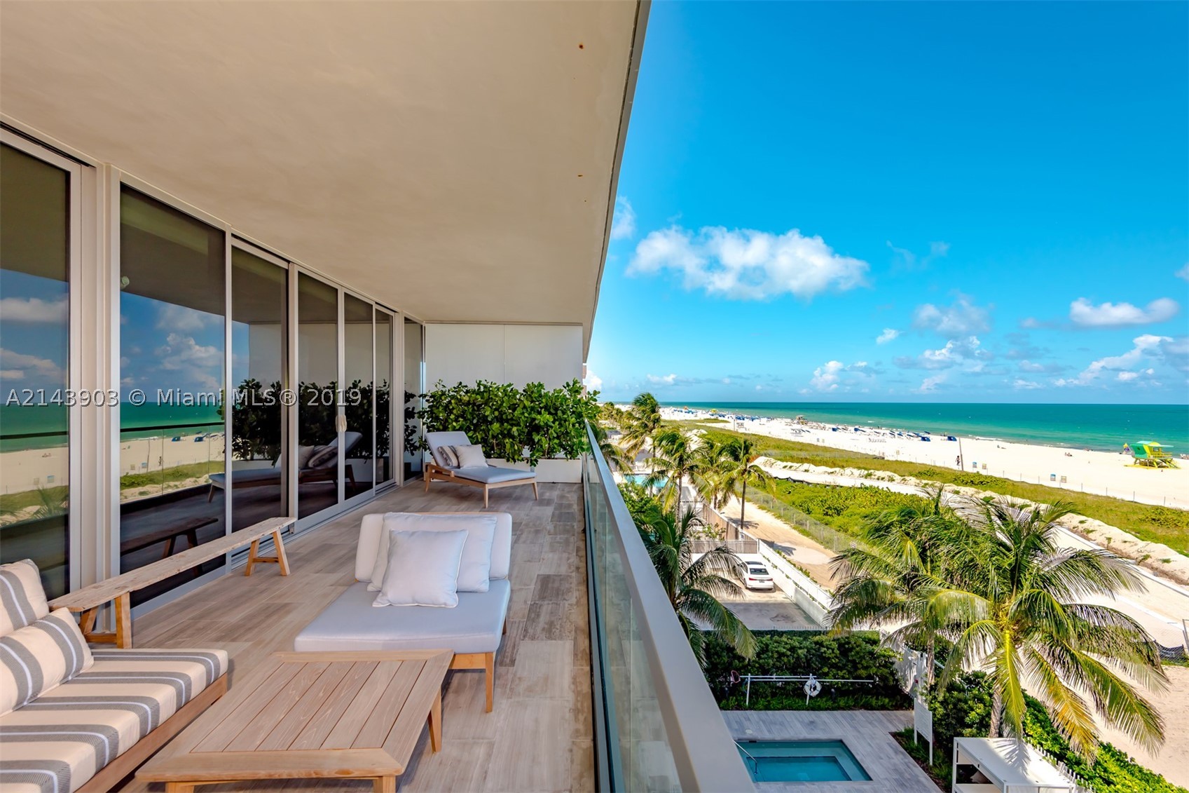 A private elevator opens up into this 4/4.5+Den. High ceilings, floor-to-ceiling glass & 10' deep terraces with direct ocean views. Open gourmet kitchen with sleek Poggenpohl cabinets, Gaggenau & Sub Zero appliances. Wood floors throughout. Signature amenities include beachfront infinity pool, library/lounge, fitness center, beach service, 24 hour valet, concierge and security. Architect: Enrique Norton.