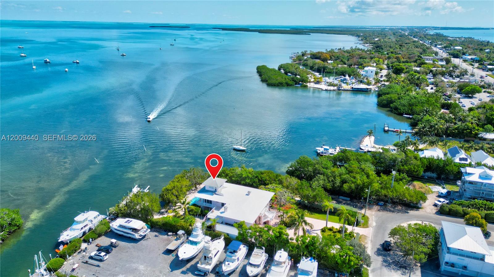 Spectacular Bayfront Estate with Guesthouse in the Heart of Islamorada

Experience luxury coastal living at its finest in this exceptional Gated bayfront estate, ideally situated in the heart of Islamorada. Set on a rare peninsula with over 225 feet of prime waterfront, this property offers unmatched privacy, panoramic views, and direct access to both the Florida Bay and Atlantic Ocean.

The main residence features 7 spacious bedrooms and 5 beautifully appointed bathrooms designed with both elegance and comfort in mind--perfect for entertaining or hosting large gatherings. A dramatic third-floor Bird's Nest Sky Lounge features 360-degree glass walls and a walkout rooftop deck, capturing breathtaking vistas in every direction. Expansive living areas and thoughtfully designed spaces capture stunning water views from every angle.

A private 1-bedroom, 1-bathroom guesthouse provides the ideal retreat for visitors, accommodating extended family, or potential rental income or creating a secluded retreat. 

For boating enthusiasts, the estate includes an impressive 85+ foot deep-water yacht slip and four boat lifts, offering seamless access to both the Bay and Ocean--an unparalleled fishing advantage in the Florida Keys.