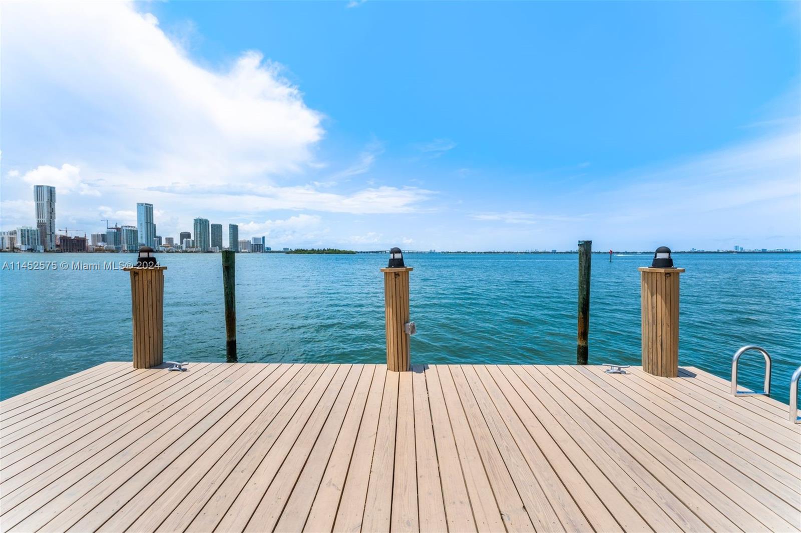 Experience awe-inspiring, panoramic views of the wide bay and Miami Skyline from this expansive 13,500 square foot lot, boasting 90’ of water frontage. Featuring 4 bedrooms and 3 bathrooms this 3,671 square foot home nestled on a tranquil cul-de-sac in the esteemed Venetian Islands, presents a rare opportunity to live on the wide-open bay. Within minutes, you can reach downtown Miami, Brickell, Miami International Airport, major highways and the world-class dining, shopping, and beaches of Miami Beach. Renovate and build your dream home or live in this mid-century modern gem with stunning vistas, bright open spaces, and multiple areas for entertaining guests or relaxing in an outdoor oasis with covered dining and a private dock.