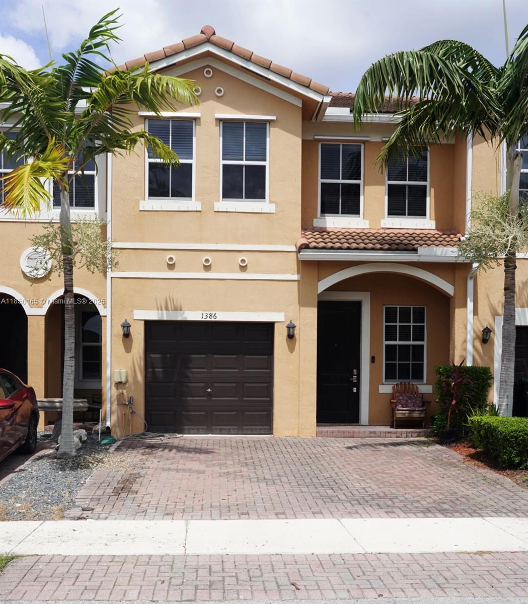 This beautifully maintained 4bedroom, 3-bath townhouse is located in the desirable Keys Garden community. The home features an open-concept layout with One Bedroom and Bath Located on the first floor. Upstairs you'll find the Primary suite with a private bath, plus Three additional bedrooms and a full bathroom as well as the luandry room  . Enjoy outdoor living in the backyard overseeing the lake view. Additional features include 1 car Garage with 2 parking spots in the front. Located near shops, schools, and major highways with easy access to the Florida Keys, this home offers comfort, convenience, and low-maintenance living
