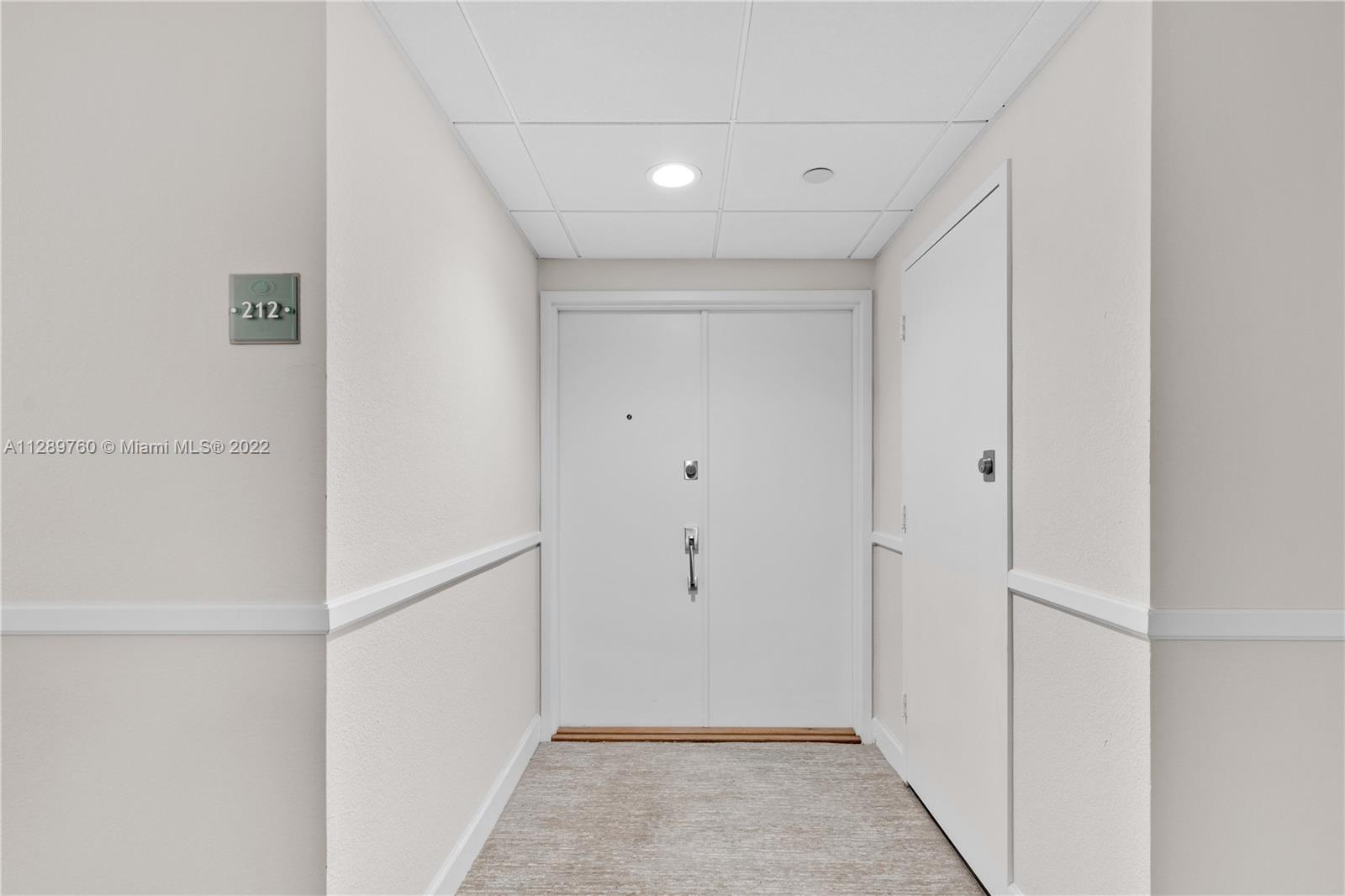 Gorgeous renovated fully furnished 2 bedroom and 2 bathroom unit by famous architect Ramon Alonso at the exclusive Commodore in Key Biscayne. features open kitchen concept with custom cabinets in high-gloss lacquer finish. Engineered wood floors throughout the unit. The primary bedroom with en-suite remodeled bathroom with double sinks and plenty of storage. Comes with one assigned and covered parking space. Commodore Club is a very well-maintained building with many amenities such as direct and private beach access where umbrellas and chairs are provided, tennis courts, a heated pool, exercise room, and more. Don't miss this opportunity.  Short term rental allowed minimum 90 days.