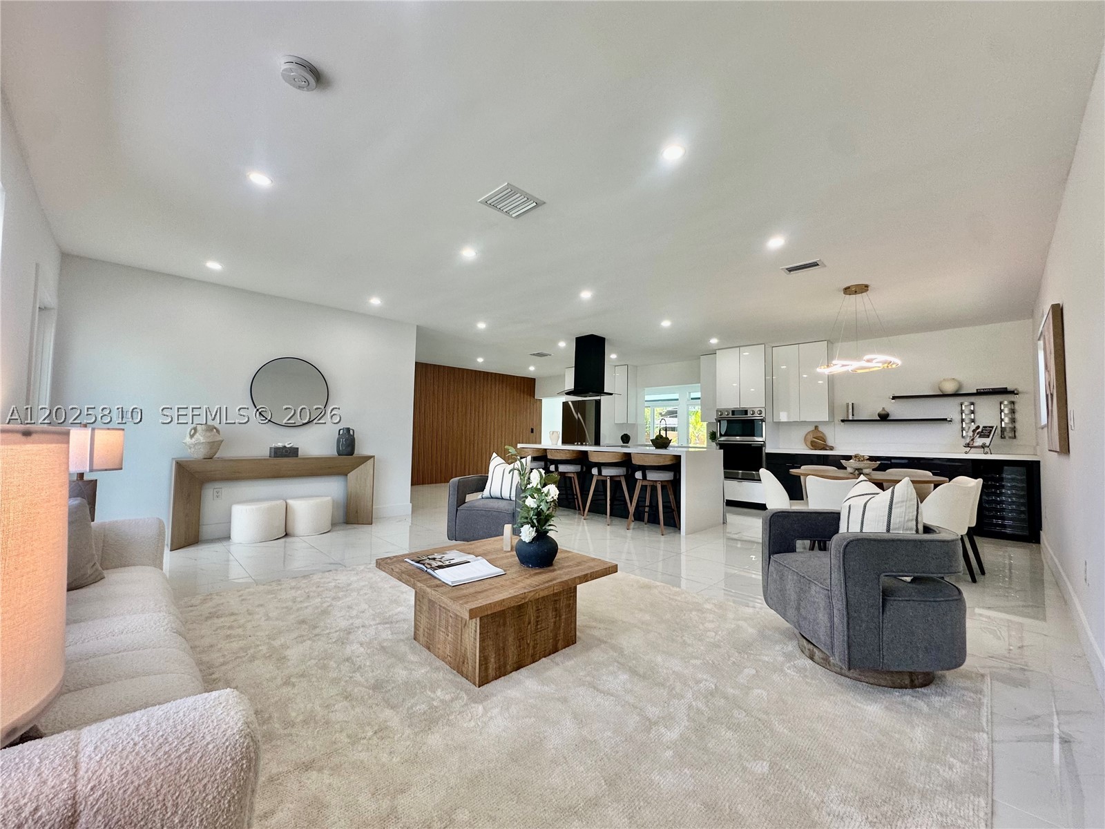 3 BEDROOMS | 2 BATHS + FLEX SPACE on an oversized 8,750 sq. ft. corner lot just 1.6 miles from the beach and vibrant Hollywood Circle. This beautifully updated open-concept home captures the best of the South Florida lifestyle with seamless indoor-outdoor living. Enjoy a spacious Florida room, sun-filled patio, and sparkling pool—perfect for entertaining or relaxing year-round. The Italian-inspired kitchen showcases a stunning 9-ft quartz island, premium Samsung appliances, and a stylish wine bar designed for gatherings. A versatile air-conditioned garage provides ideal space for a home office, gym, studio, or additional living area. Additional features include impact windows and doors, privacy fencing, and ample space to park your boat or RV. Modern comfort meets coastal charm in this exceptional property. Easy to show, contact listing agent today!