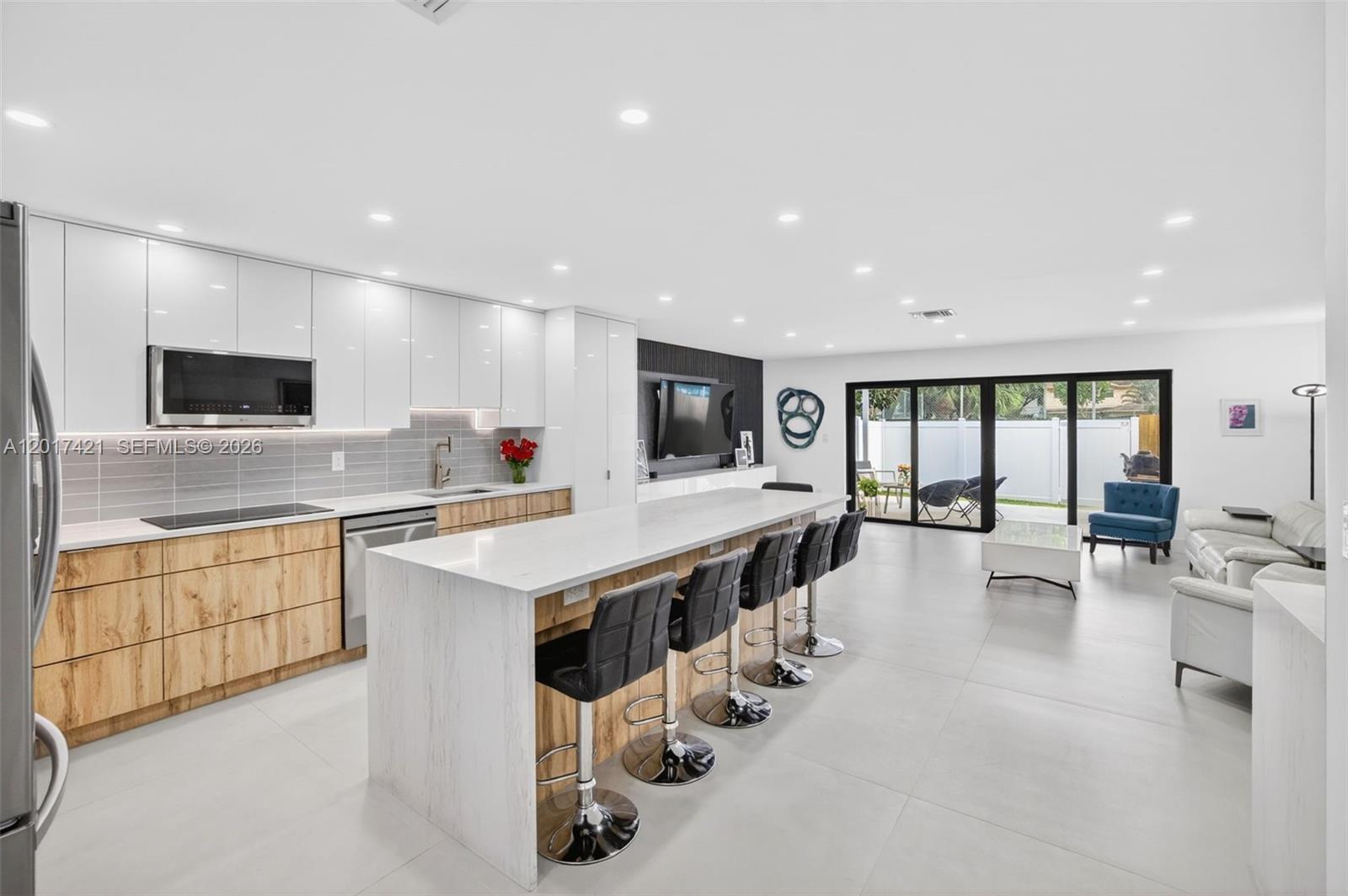 SHOW YOUR PARTNER - THIS IS THE ONE!! Completely reimagined & thoughtfully upgraded 2BR+/2.5BA in highly desirable Emerald Hills, offering exceptional flexibility with multiple additional rooms that can function as a potential 3rd bedroom + private office, den & hideaway.

This light-filled home features bright, open interiors w/ modern finishes & STORAGE. The flexible split-bedroom floor plan provides ideal privacy, while the additional flexible spaces enhance functionality for guests, multi-generational living, or seamless work-from-home use. Stunning brand-new kitchen showcases custom cabinets, a large center island with quartz waterfall counters, dedicated electrical circuits, and all-new appliances including refrigerator, cooktop, wall oven, microwave, wine cooler & dishwasher. Extensive upgrades include a NEW S-TILE ROOF, new driveway and patio concrete, patio SHADE STRUCTURE, 48x48 tile flooring on the first level, ENGINEERED WOOD floors upstairs, new wood staircase with modern metal railing & full IMPACT WINDOWS throughout, GORGEOUS BATHROOMS, CUSTOM CLOSETS & new doors & hardware. 

Located in the heart of Emerald Hills, for unbeatable convenience just steps from houses of worship, dining, and TY Park. Minutes to I-95, Hollywood Beach and the Broadwalk, world-class golf, and Memorial Hospital. LOW MAINTENANCE, HOA just $180/month with pool area!

A rare blend of modern design, flexible living, and prime location—move-in ready and truly turnkey.