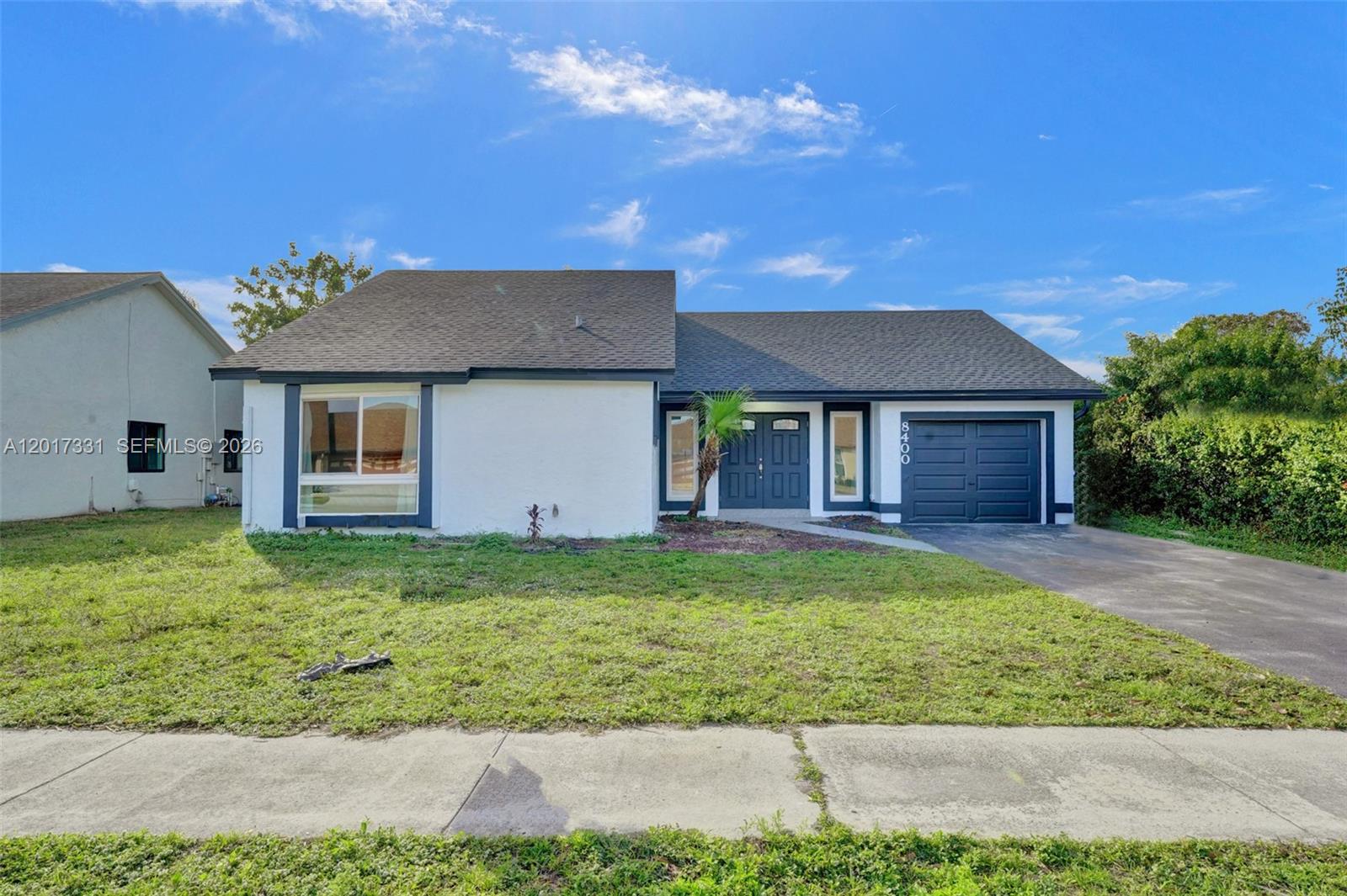 Beautifully renovated 3-bedroom, 2-bath home with garage in a quiet, centrally located Pembroke Pines community. This move-in ready property features a fully permitted renovation, offering peace of mind and modern finishes throughout. Enjoy a spacious layout, screened-in pool, and serene lake views that create the perfect South Florida lifestyle. Conveniently located near major highways, shopping, dining, parks, and top-rated schools while still tucked away in a peaceful neighborhood.