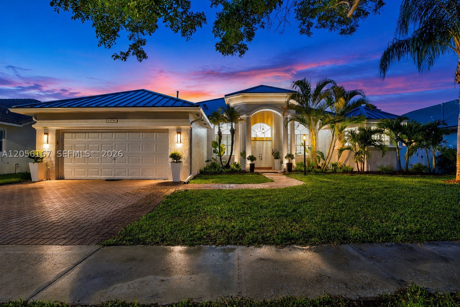 A true showpiece in prestigious Pembroke Falls, this fully renovated custom residence delivers luxury, scale, and style at every turn. Offering 6 bedrooms, 4 baths, and a 2-car garage, the home welcomes you with soaring smooth ceilings, oversized porcelain tile flooring, designer lighting, modern doors, and a thoughtfully designed layout with elegant living and entertaining spaces. The chef’s kitchen makes a striking statement with modern shaker cabinetry, waterfall-edge quartz countertops, stainless steel appliances, gas range, wall oven, microwave, power ventilator, and island serving bar. The private primary suite is a retreat of its own, featuring a custom California closet/dressing room. The spa-inspired baths include designer vanities, quartz tops, lighted mirrors, rain shower heads, floor-to-ceiling tile, frameless glass, and a jetted Jacuzzi tub. Generous guest rooms include custom closets, while thoughtful upgrades include updated electrical, TV prewiring, LED lighting, designer fans, and a custom utility room with cabinetry, sink, and folding station. Outdoors, enjoy an expansive covered open-air patio framed by lush tropical landscaping, while front exterior accent lighting beautifully highlights the porch pillars and palm trees for striking curb appeal. Freshly painted inside and out with a NEW METAL ROOF, this is the turnkey luxury home buyers wait for. Pembroke Falls Residents enjoy Resort-Style 5-Star Amenities.  HOA includes cable, internet, and alarm. HURRY..