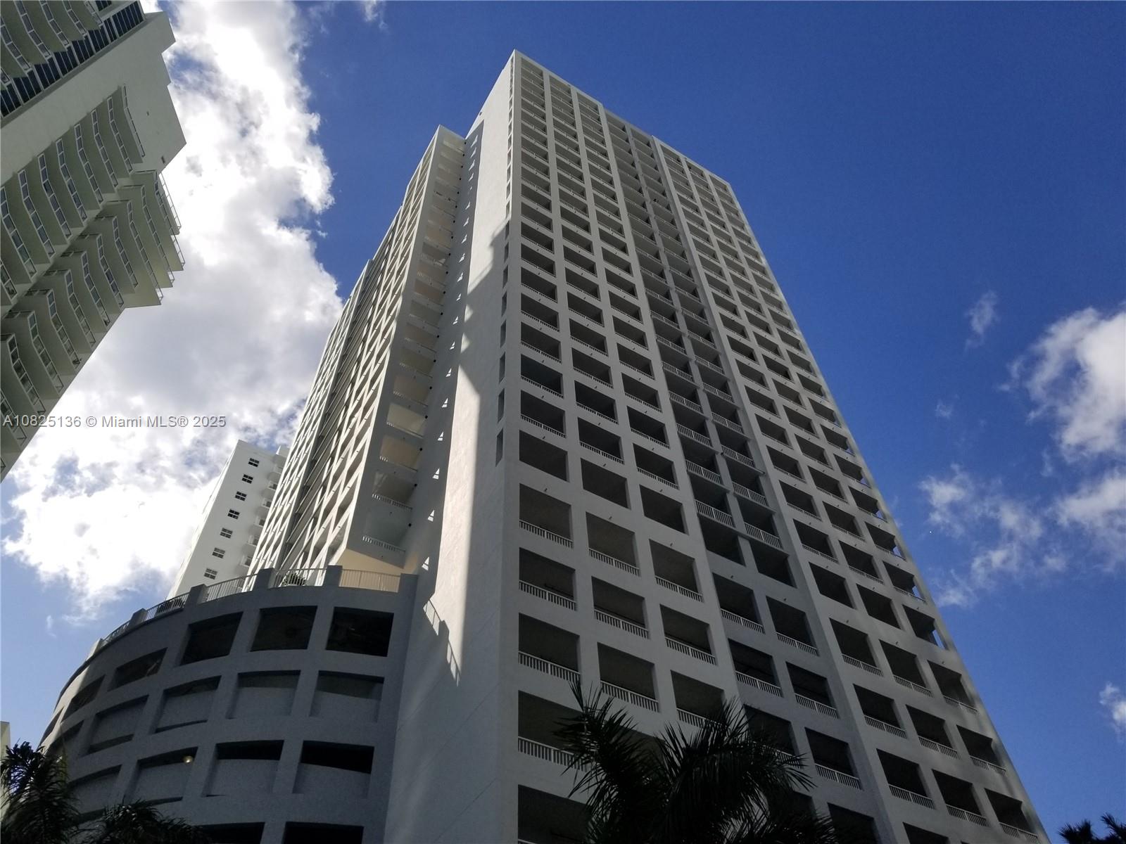 This west-facing 1-bedroom, 1-bathroom residence sits on the 14th floor of The Sail in Miami. The condo features an enormous open balcony accessible from both the living room and the bedroom, providing skyline views. The building stands at Brickell and 14th Street, placing residents one block from the bay and within walking distance to Mary Brickell Village. The condominium amenities include a pool, sauna, and exercise room. The unit provides one assigned parking space in the garage.  The seller requires a cash-only transaction. The buyer must respect the current lease, which generates $2,800 per month and expires on January 31, 2027. The Sail permits short-term rentals with a 30-day minimum, pending HOA approval for tenants. Buyers must submit offers with a signed condo rider and seller disclosure, and the contract must stipulate a maximum 7-day inspection period.