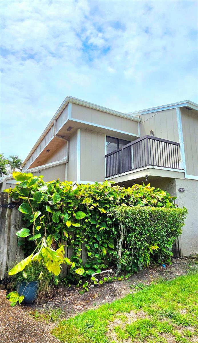 Welcome home! This spacious residence feels like a single-family home and is actually larger than the tax rolls reflect. The open floor plan features tile flooring throughout the main living areas, wood floors upstairs, upgraded bathrooms and kitchen, a generous laundry/utility room, and convenient under-stair storage. Step outside to your rare, fully fenced private backyard with mature fruit trees that *actually produce*, plus a large patio and an upstairs balcony overlooking the entire space — perfect for relaxing or entertaining. 2 assigned parking spots and plenty of guests for your visitors. You won’t find a better location in all of Broward. Just one minute from major highways, you’re about 30 minutes from anywhere in South Florida. Enjoy being close enough to the arena, parks, and Sawgrass Mills Mall that you can bike or even walk there.
To top it all off, the association fee includes homeowners insurance, making this an unbeatable value. This home is perfect for FHA and VA buyers, but it will be a great investment for an investor too! Bring your offer and make this beautiful home yours.