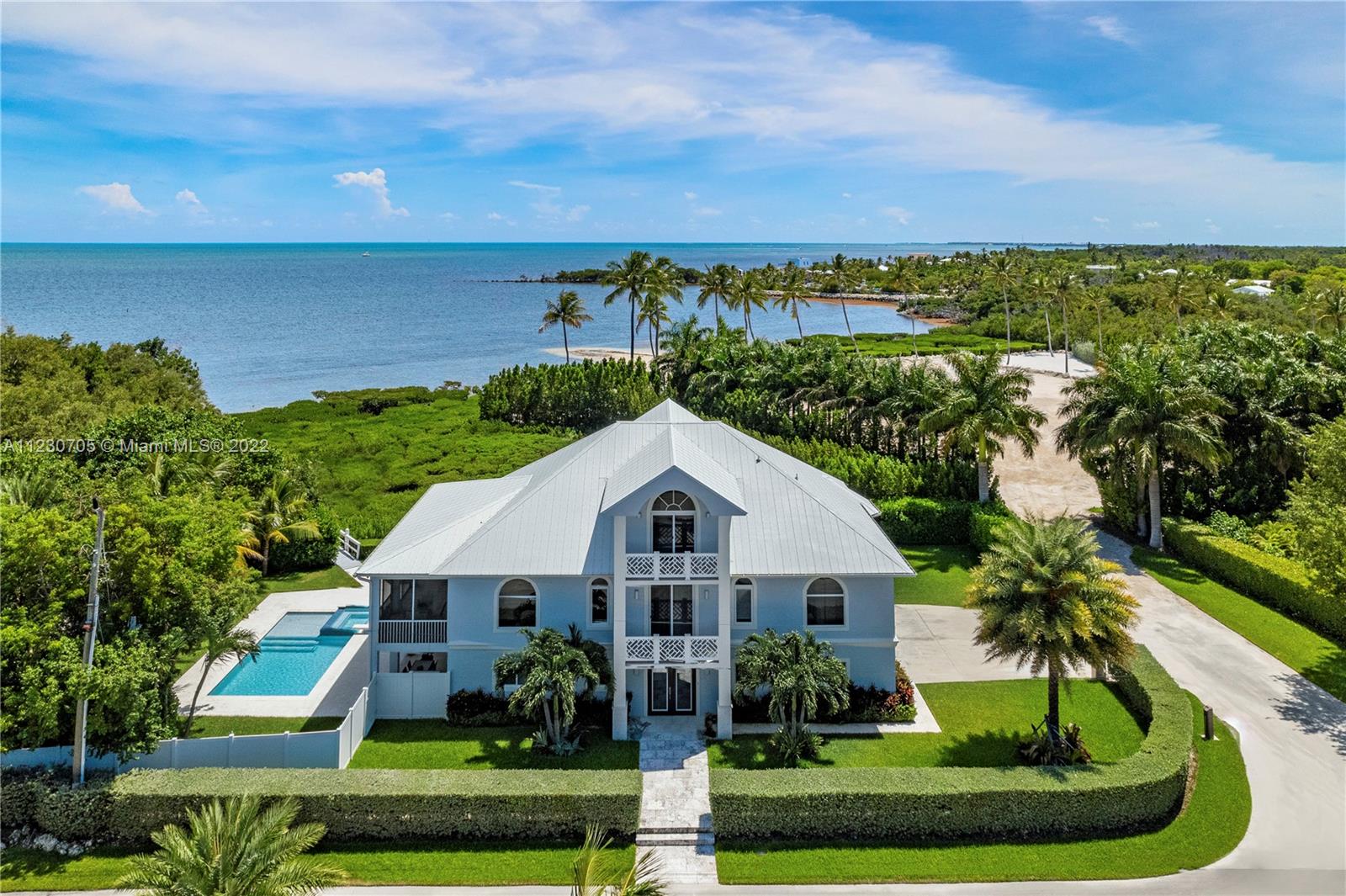 The ultimate private retreat awaits within the Plantation Point community of exclusively 3 oceanfront homes. 
 
Fully renovated in 2018, this 5-bedroom dream property offers exceptional ocean views and bright sunlight throughout all living areas and bedrooms. The main level includes impressive high-vaulted ceilings, an open chef’s kitchen, custom cabinetry, eat-in and formal dining arrangements, and a vast great room alongside an ample covered terrace. Incredible ocean views are offered from many of the bedrooms, some with private balconies. Other features include a private elevator, ground floor family room, 3 car garage, laundry facility, heated pool & jacuzzi, private pier, and deeded dock space for one +/- 35' boat or 2 smaller boats.