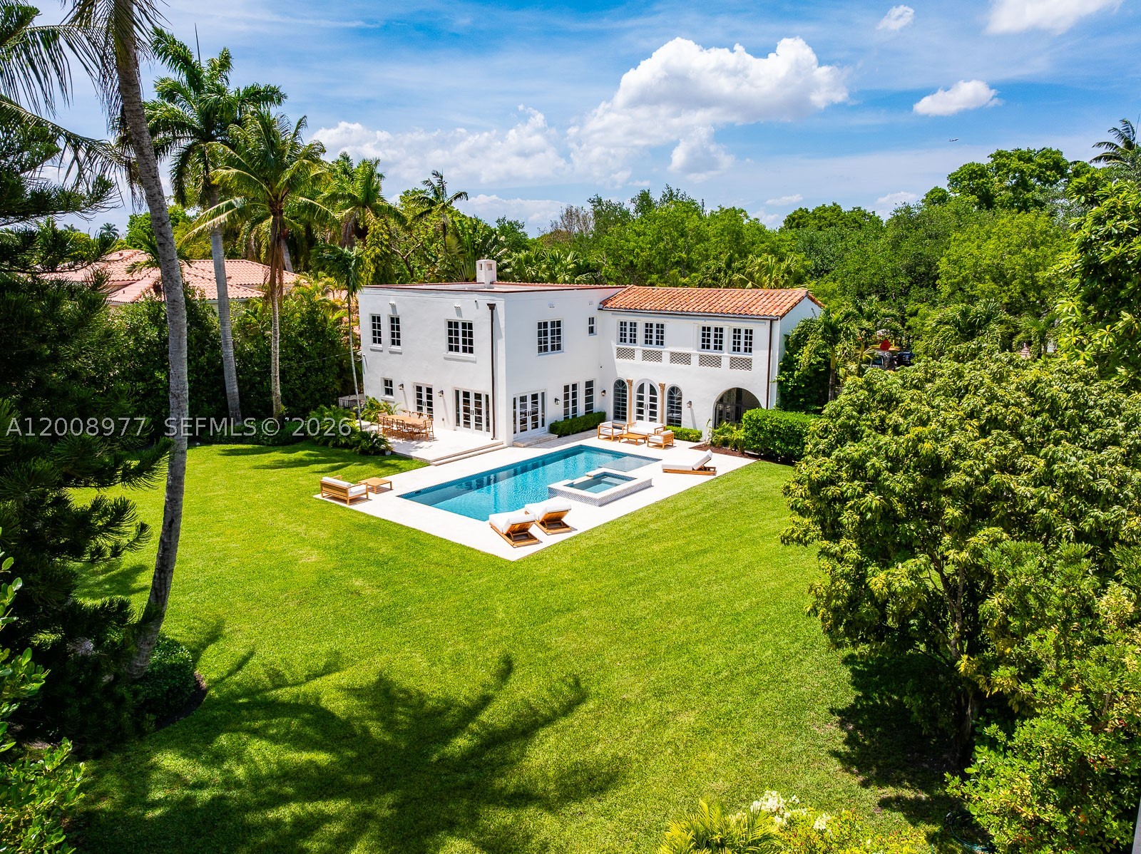 On a vast, park-like half-acre-plus property, this venerable, classic "Old Spanish" style villa—designed by Alexander Dentman and greatly expanded in 1929 by Phineas Paist—offers preserved original charm and character in perfect harmony with its recent professional updating. There is a main two-story residence and a lavish 2-bedroom, two-bath separate guest house. Both structures are fully renovated with impact windows, new bathrooms, chef's kitchen with 6 burner Viking gas range and brand-new Sub-zero refrigerator, new 37' long pool, new landscaping and more. Phineas Paist (1873–1937) was the supervising architect for the Coral Gables Corporation and is credited with shaping the aesthetic identity of Coral Gables, Florida. He was a master of the Mediterranean Revival style, often collaborating with artists like Denman Fink to create iconic public spaces and landmarks. His portfolio includes some of the most recognizable structures in South Florida, many of which are listed on the National Register of Historic Places including Villa Vizcaya, Coral Gables City Hall, Venetian Pool, The Colonnade Building, the Old United States Courthouse and Douglas Entrance. This walled and gated close to 5000 square foot home has 6 bedrooms and 4.5 baths and is located close to The Coral Gables Country Club, Granada Golf Course, the Venetian Pool and is just a 15-minute Uber ride to Miami International Airport.