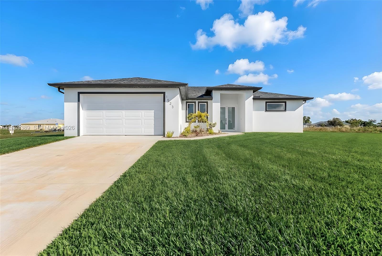 New Construction Home in Desirable Cape Coral! This beautifully designed single-family residence features a split-bedroom floor plan with 3 bedrooms, a den, 2 full bathrooms, plus a half bath on the lanai; ideal for a future pool. Situated on a rare triple corner lot with a freshwater canal, the home offers a 2-car garage, lanai, and premium upgrades throughout. Highlights include quartz countertops, modern white cabinetry, stainless steel appliances, tile flooring, glass showers, high ceilings, luxury tall interior doors, impact-resistant windows and doors, and a washer and dryer included. Conveniently located near top-rated schools, shopping, dining, BJ’s, Super Target, and Lowe’s. (Motivated seller as well as closing cost assistance available).