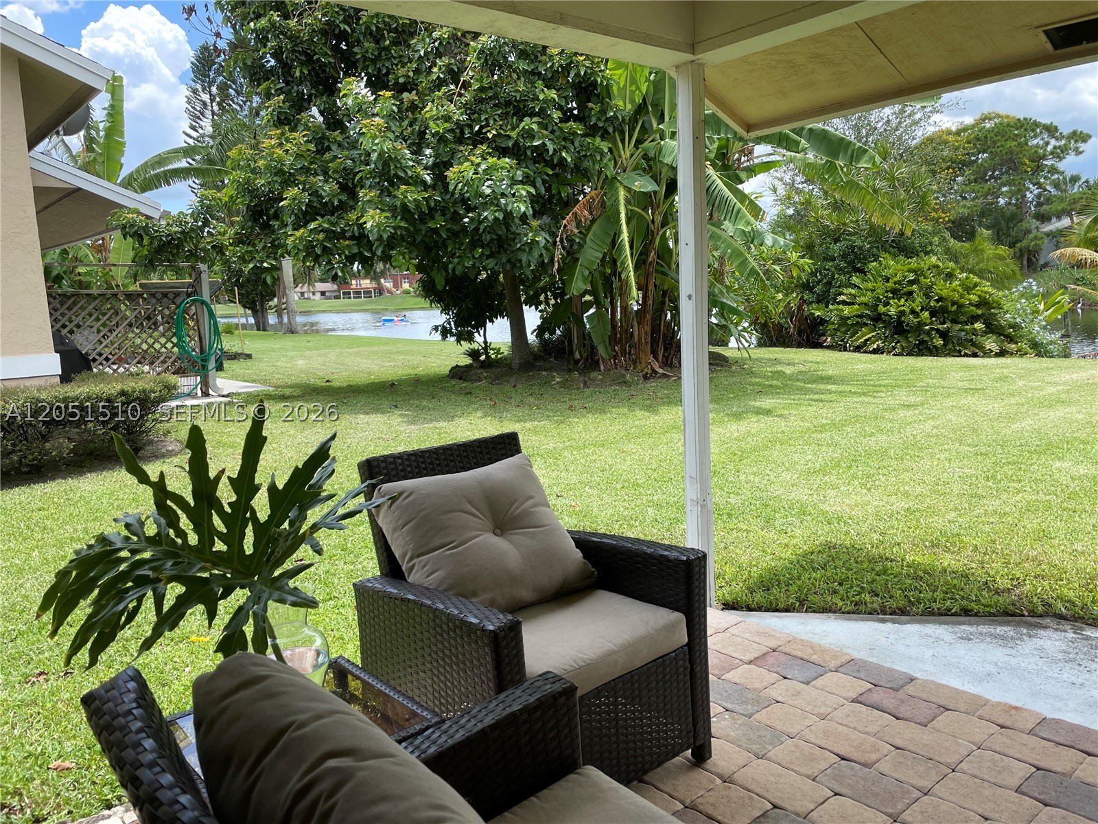 Bring your trucks, Garage with additional storage, in-unit washer & dryer, abundant natural light, and beautiful lake views. This bright and airy turnkey 2-bedroom end-unit villa features two king-size bedrooms, all-tile flooring (no carpet), and an open, spacious layout. Ideally located within walking distance to the Wellington Amphitheater and Publix on Forest Hill Blvd, just 5 minutes from Wellington International Showgrounds, 10 minutes from Palm Beach International Airport, and minutes from highly rated Elbridge Gale Elementary School.