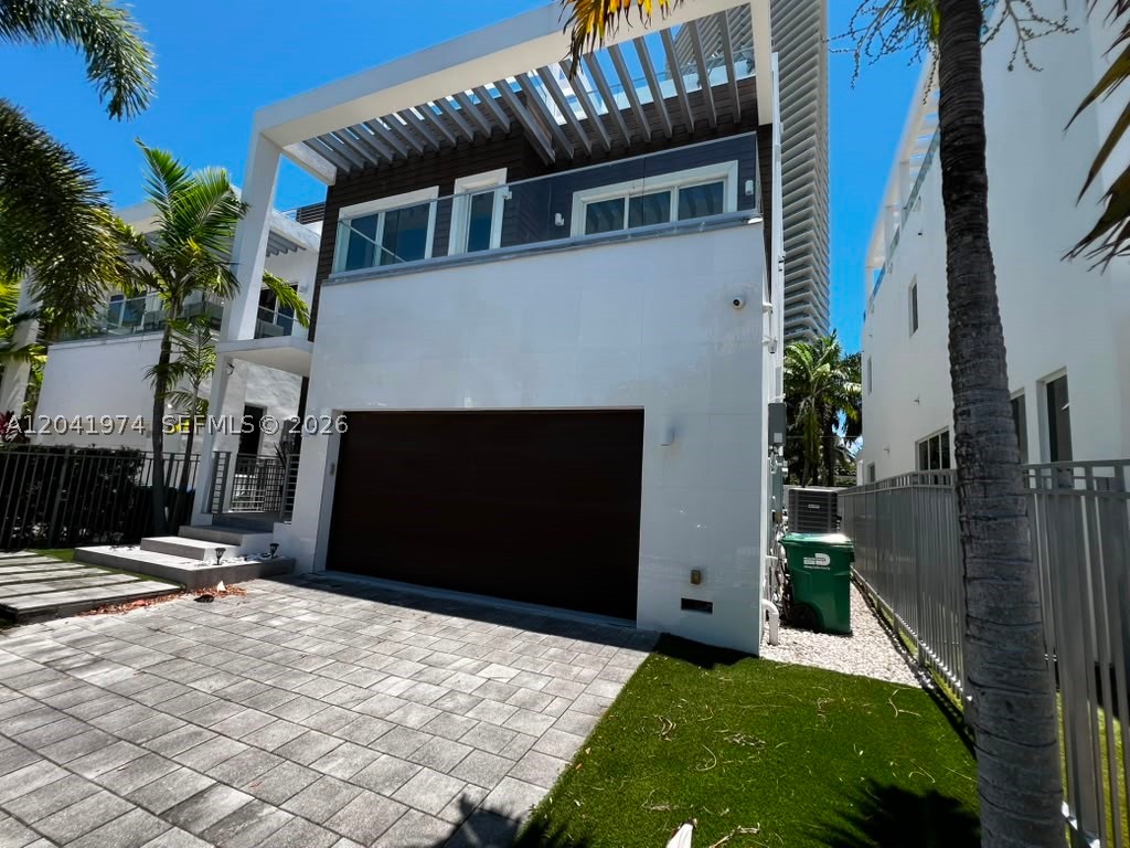 Experience luxury coastal living in this brand-new modern estate located just steps from the ocean in the heart of Sunny Isles Beach. This private, gated residence offers 7 bedrooms and 6 bathrooms, featuring exceptional craftsmanship and designer finishes throughout. The gourmet Snaidero kitchen is equipped with top-of-the-line Miele appliances, complemented by over $30,000 in Swarovski lighting fixtures, white glass-gloss flooring, elegant glass railings, and premium materials throughout.

Designed for both comfort and entertaining, the home boasts a resort-style pool, expansive patio terrace, outdoor dining area, BBQ station, and summer kitchen. The spectacular rooftop entertainment area offers the perfect setting for gatherings while enjoying ocean breezes. An owner-built third-floor addition provides two additional bedrooms, creating a flexible 7-bedroom layout. Additional features include a two-car garage, spacious living areas, and a fully equipped designer kitchen. This extraordinary residence combines privacy, luxury, and an unbeatable location directly across from the beach, offering a true five-star resort lifestyle.