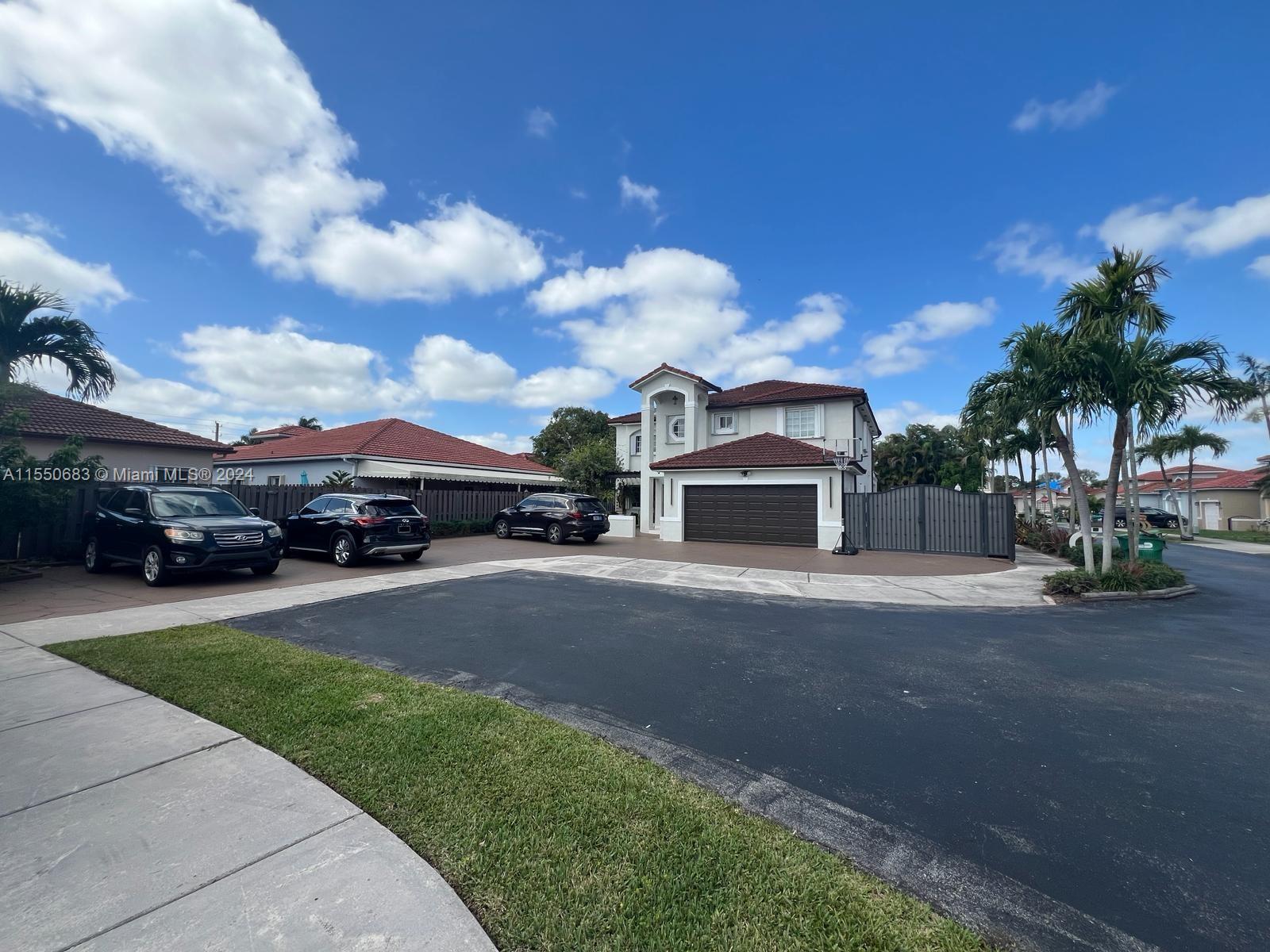 This beautiful Contemporary home is located in a Kendal community with restricted access providing greater security for your family, Inside the newly renovated modern & bright interiors you'll find large living spaces w/ dramatic double height ceilings, gourmet kitchen, family room. The outdoors is a tropical oasis w/ a large covered outdoor kitchen, resort style pool. This Property is equipped w/ a 2-car garage. Low Assoc sonly $40.00 monthly.
