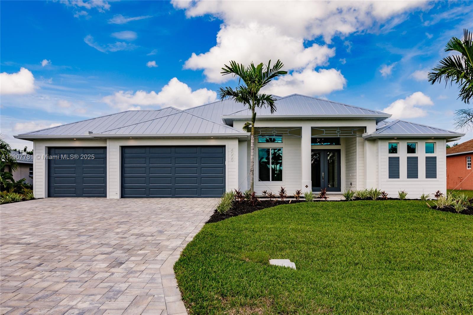 Welcome to this stunning new construction pool home in desirable Southwest Cape Coral, with all city assessments paid! This 2,200+ sq ft residence features 4 bedrooms, 2 baths, and a 3-car garage. Enjoy hardwood floors, plush bedroom carpet, and impact-resistant windows and doors. The open-concept living area showcases a dramatic accent wall and 90-degree sliders for seamless indoor-outdoor living. The primary suite offers a wood beam ceiling, private pool access, and a spa-like bath with dual vanities, soaking tub, and rain shower. The chef’s kitchen shines with custom cabinets, granite counters, and stainless appliances. Outside, enjoy the oversized screened lanai, sparkling pool, and fenced yard. Virtually staged—ask about seller financing!