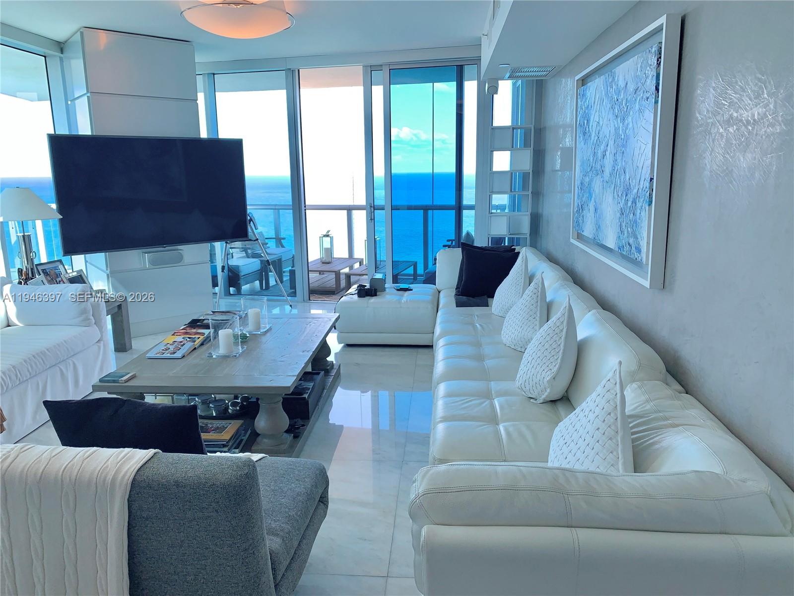 Remodeled corner unit, full of upgraded finishes. Two wraparound balconies, marble floors throughout, High-end finishes, spectacular ocean and intracoastal views, 4 bedrooms, 4 1/2 bath, offers open floor plan from Ocea and City views, enjoy Sunrise from living room and master bedroom and Sunset form second and third bedroom and kitchen. Living room and master bedroom overseeing the ocean, fully equipped kitchen, Miele appliances and Sub-Zero refrigerator, lots of walking closets, wood walls, automated lights, blinds and A/C, 2 assigned covered parking spaces and Valet Parking. Top class amenities, 2 pools, Spa, fitness room, children's play area, Beach and pool service and gar, 24 hours Valet and doorman. One-of-a-kind building in Sunny Isles, design by Arq Carlos Ott, Unfurnished unit. Easy to show, Tenant occupied till February 28 th 2026