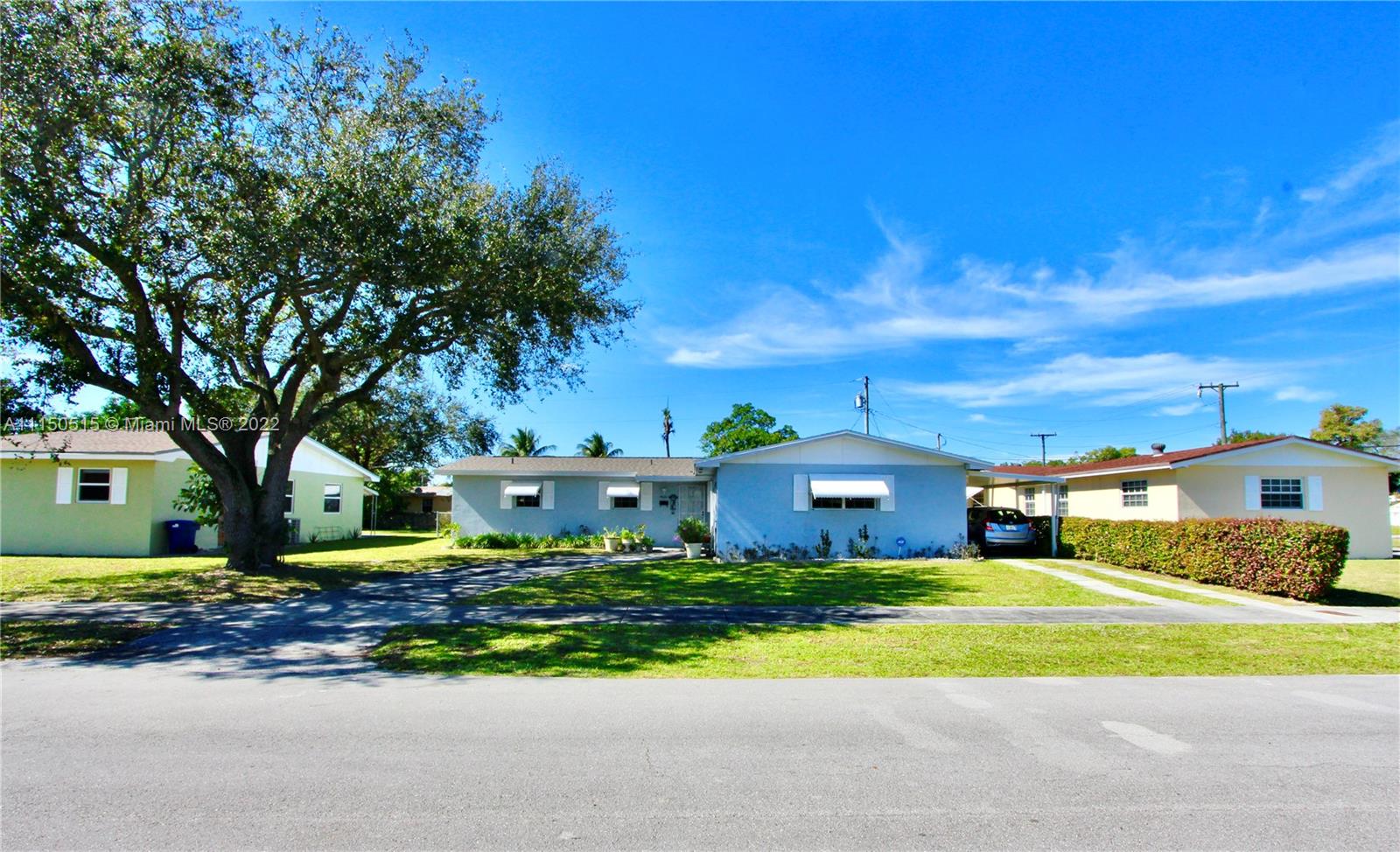 Just listed this charming house to call your new home. This 3-bedroom, 2-bath house is move-in ready. The previous garage was transformed into a family room, which makes an open entertaining area with the kitchen. A part of the garage remains, forming a generous sized utility room including washer & dryer. Permits were submitted allowing for this bonus feature. Updates to the home include a new roof, remodeled kitchen & bathrooms w/ granite counter tops, stainless steel appliances, bamboo wood & tile flooring, car port & huge screened in patio for outdoor entertaining! The fenced in back yard is perfect for pets with a large shed for storage. Sprinkler system is as is. The dining room chandelier & the drapes do not stay. Close to I-95 ,  two airports, and beaches. Walk to great schools.