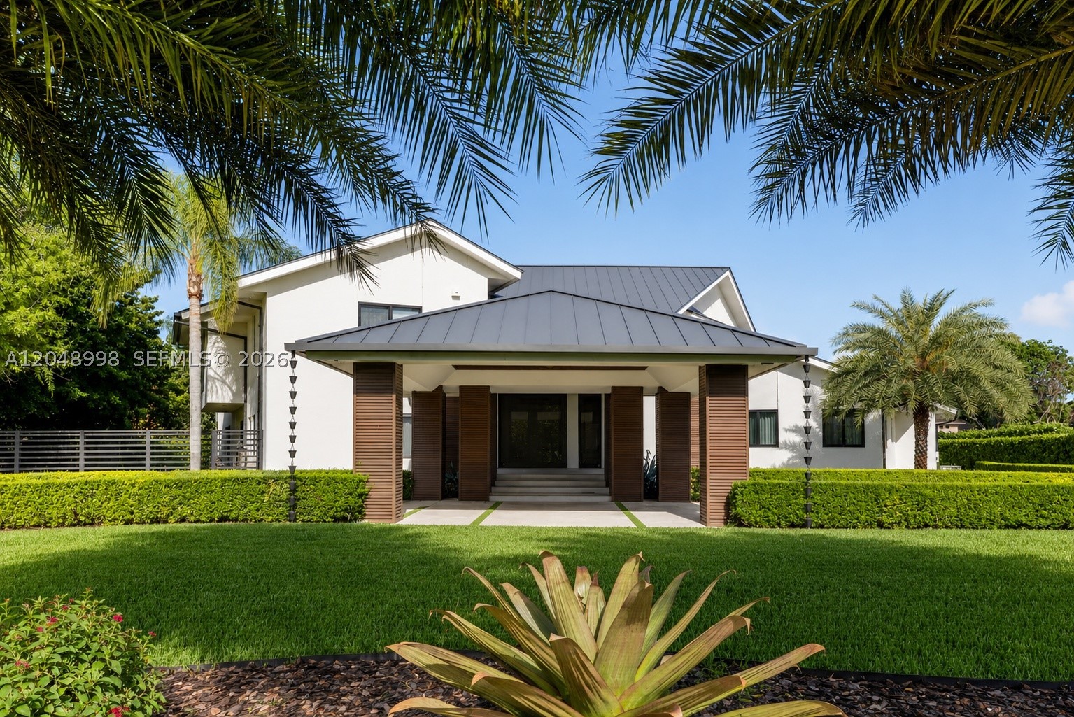 Experience the ultimate in modern elegance with this fully renovated, custom-designed residence set on 40,075
sqft lot in the prestigious Galloway Glen neighborhood. This 6-bedroom, 5-bath masterpiece showcases a triplesplit floor plan and nearly 6,832 sq ft of interior living space, 48x48 European porcelain tiles, LED lighting, sleek
aluminum railings, and rich custom walnut wood accents. Entertain effortlessly with resort-style amenities,
swimming pool, spa, tennis and basketball courts, and a custom outdoor BBQ kitchen. The luxurious primary suite
offers a private bar, custom walk-in closets, a spa-inspired bath with sauna, and balconies overlooking the pool.
Addt'l features: Metal roof, impact-rated windows and doors, and a 3 car garage.