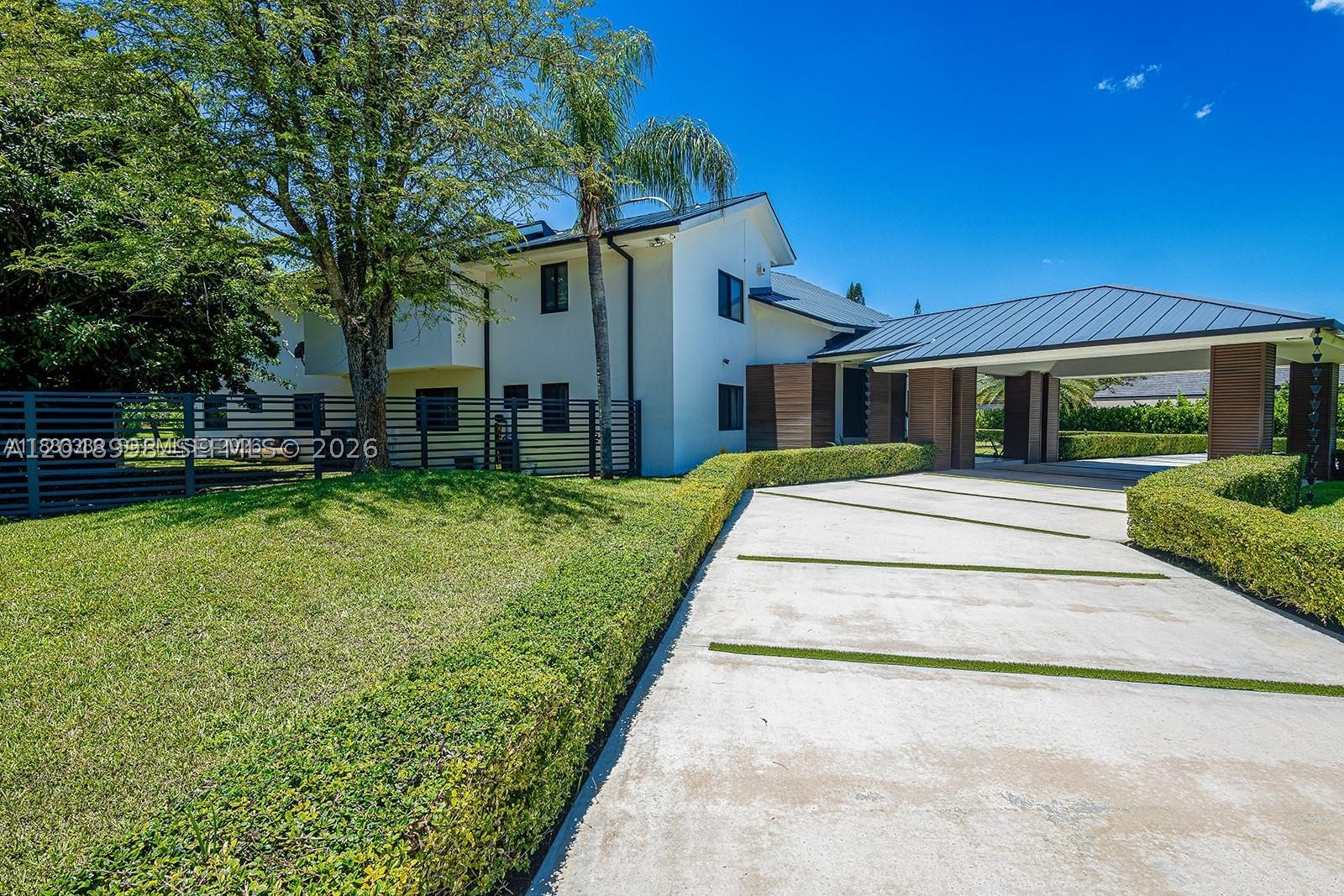 Experience the ultimate in modern elegance with this fully renovated, custom-designed residence set on 40,075
sqft lot in the prestigious Galloway Glen neighborhood. This 6-bedroom, 5-bath masterpiece showcases a triplesplit floor plan and nearly 6,832 sq ft of interior living space, 48x48 European porcelain tiles, LED lighting, sleek
aluminum railings, and rich custom walnut wood accents. Entertain effortlessly with resort-style amenities,
swimming pool, spa, tennis and basketball courts, and a custom outdoor BBQ kitchen. The luxurious primary suite
offers a private bar, custom walk-in closets, a spa-inspired bath with sauna, and balconies overlooking the pool.
Addt'l features: Metal roof, impact-rated windows and doors, and a 3 car garage.