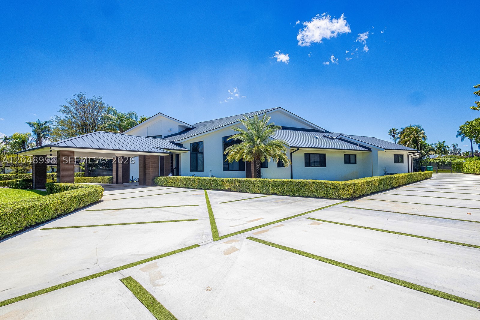 Experience the ultimate in modern elegance with this fully renovated, custom-designed residence set on 40,075
sqft lot in the prestigious Galloway Glen neighborhood. This 6-bedroom, 5-bath masterpiece showcases a triplesplit floor plan and nearly 6,832 sq ft of interior living space, 48x48 European porcelain tiles, LED lighting, sleek
aluminum railings, and rich custom walnut wood accents. Entertain effortlessly with resort-style amenities,
swimming pool, spa, tennis and basketball courts, and a custom outdoor BBQ kitchen. The luxurious primary suite
offers a private bar, custom walk-in closets, a spa-inspired bath with sauna, and balconies overlooking the pool.
Addt'l features: Metal roof, impact-rated windows and doors, and a 3 car garage.