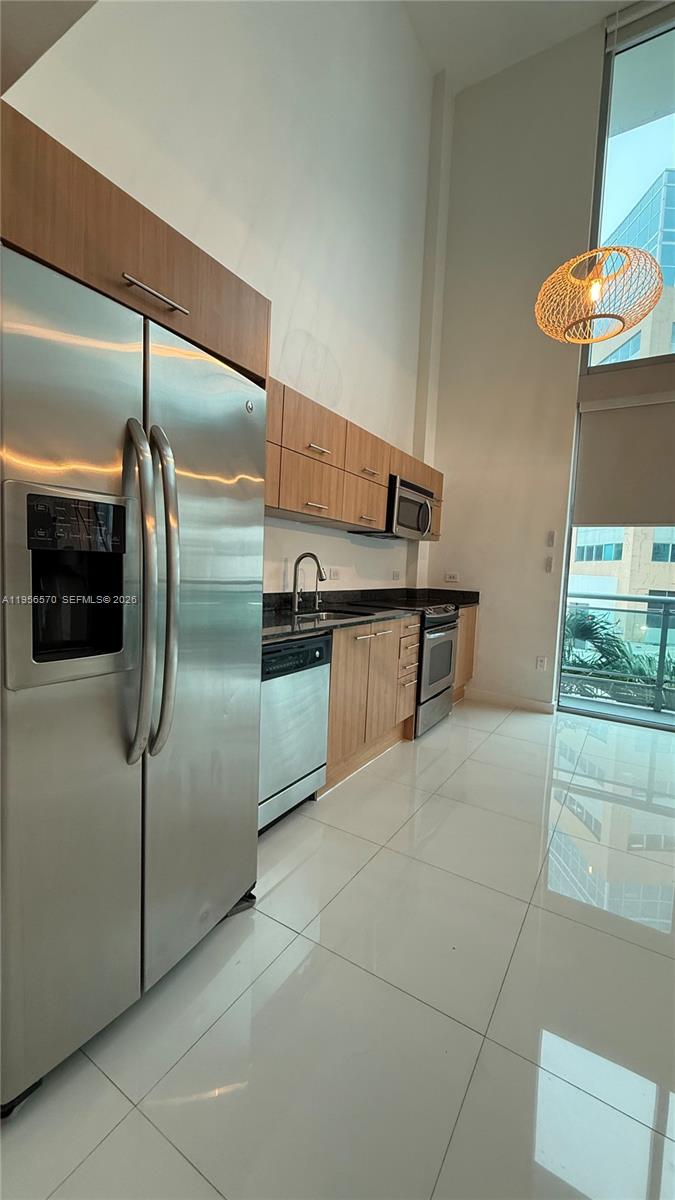 Beautiful and spacious 2 bedroom, 2 bath Loft-Style residence in Wind Condominium. Floor to ceiling windows and 1029 SF of modern living space. This light-filled residence features an open layout with a sleek European kitchen, stainless steel appliances and granite countertop. Wind is a river front condo with top-tier amenities, in a gated community and close distance to Brickell City Centre, Metro mover and the Financial District of Brickell. Amenities include a Clubhouse, Men and women spa with steam room and sauna, private massage rooms, state of-the-art two story gym, sports lounge, cigar parlor and playroom, 40,000 square foot outdoor tropical oasis with a River front pool, 24-hour valet, and professional concierge.