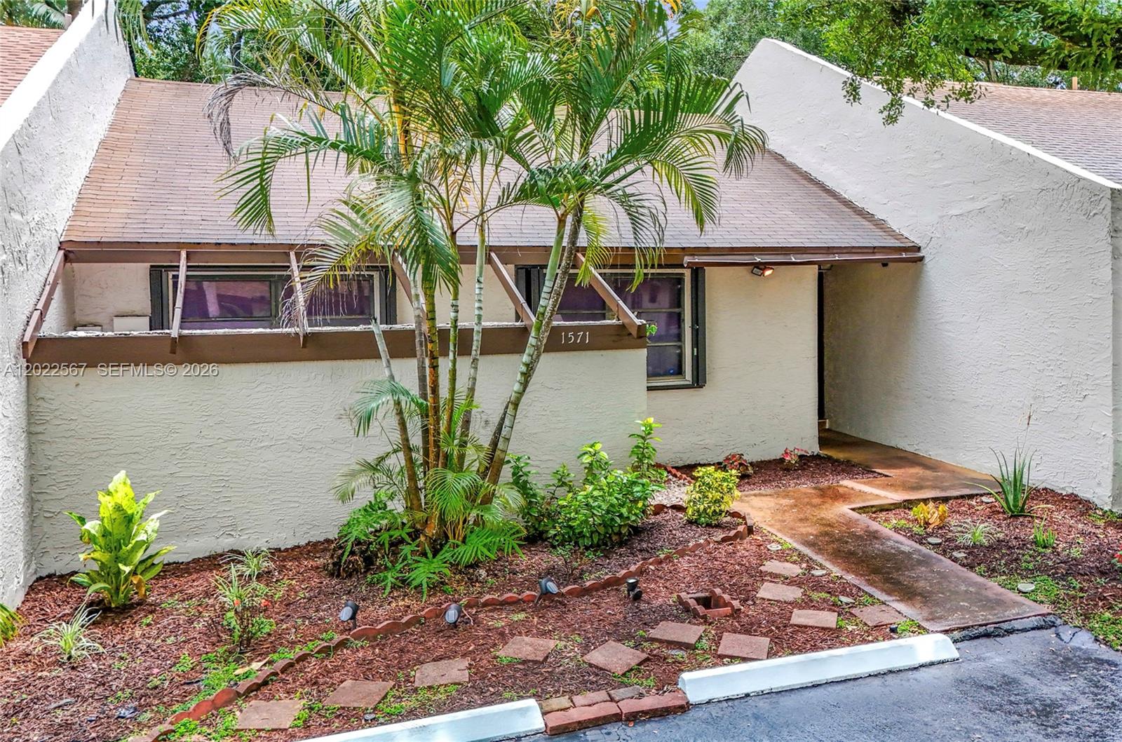 Rarely available property now for sale in Pembroke Pines. This 2-bedroom, 1.5 bath townhome features  a bright living room, functional kitchen with pantry storage, and an oversized screened sunroom that expands how you can live, work, host, and relax. Two parking spaces plus guest parking make daily life easier. Residents also enjoy access to a nearby tennis court, community pool, child play area, mature trees, and green space. Best of all, the townhome is located in a central Broward location close to shopping, dining, parks, and major roads.