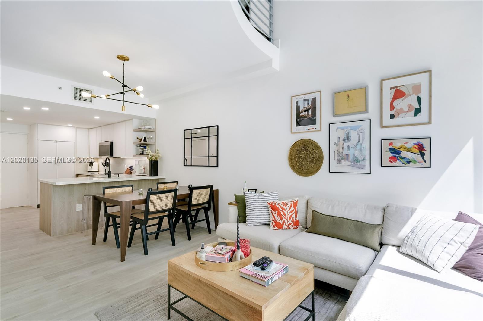 Completely renovated 1 bedroom 1.5 bath loft in the heart of Coconut Grove. Brand new everything, AC, water heater, fixtures, vanities, cabinets, shower enclosures, top of the line appliances  etc.  Beautiful kitchen with quartz countertops that opens to a light filled, double height ceiling living area with French doors that lead to a charming outdoor balcony. Upstairs is an oversized primary suite with office area, balcony, 2 closets and spa like bath. Unit comes with 1 assigned parking space. Live steps away from Cocowalk, the shops and restaurants of the Grove and beautiful parks and marinas. Building amenities include pool, gym, onsite management.  Unit is currently rented until November.