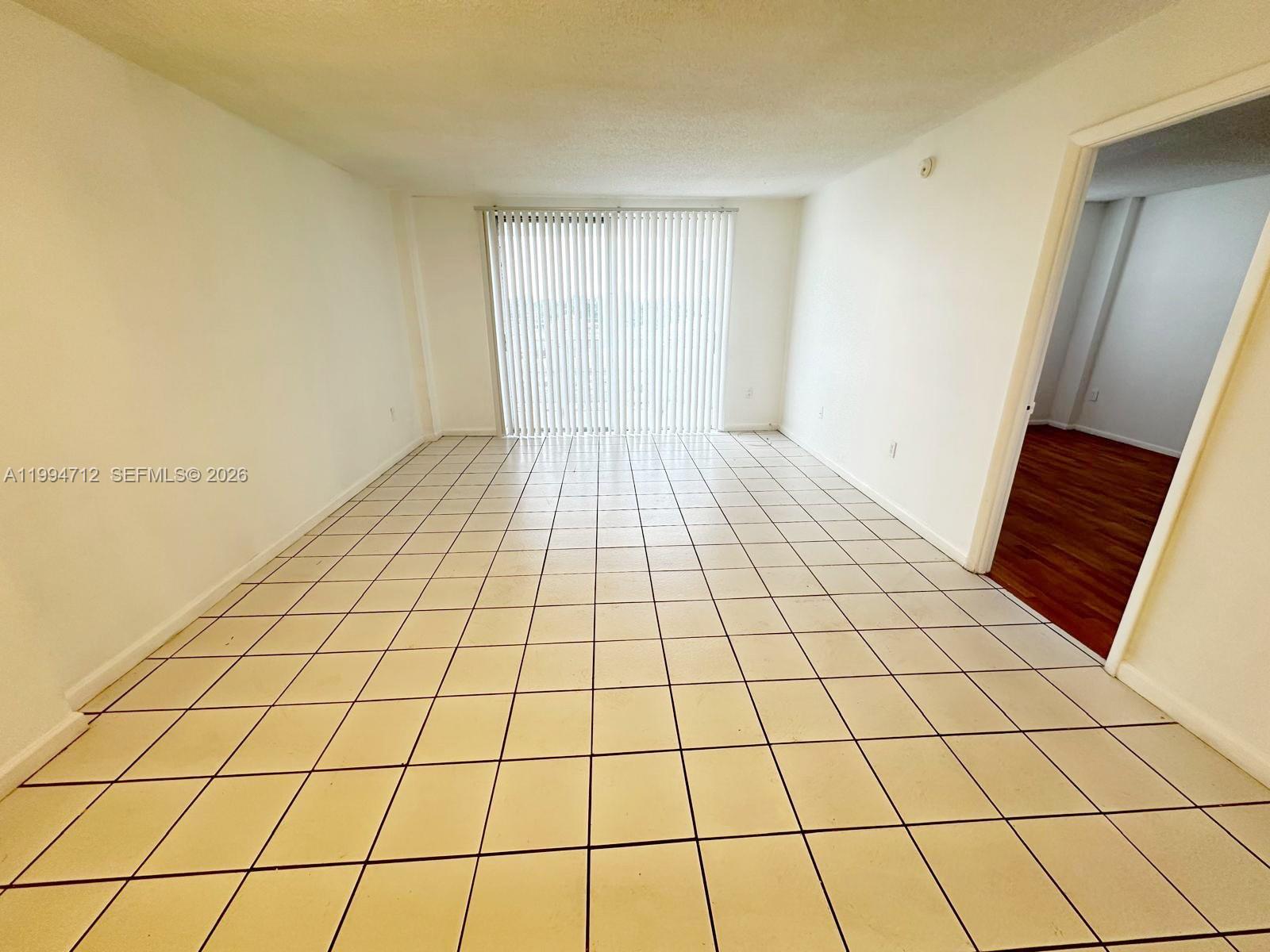 This beautifully maintained 1-bedroom, 1-bath condo features laminate and tile floors, spacious closets, and a bright, airy living space with a stunning balcony view. Centrally located, it offers easy access to highways, public transportation, and nearby restaurants. Enjoy fantastic amenities including a pool, sauna, elevator, secure parking, and a library. Just 20 minutes from beaches, Miami International Airport, and Aventura Mall, this condo is perfect for both personal living and investment. Whether you're looking for a home or rental property, this is an opportunity you won't want to miss!----------UNIT RENTED TILL 5/31/2027, PAYS $1,440.00 PER MONTH - tenants can open the door with 24hs notice in advance
