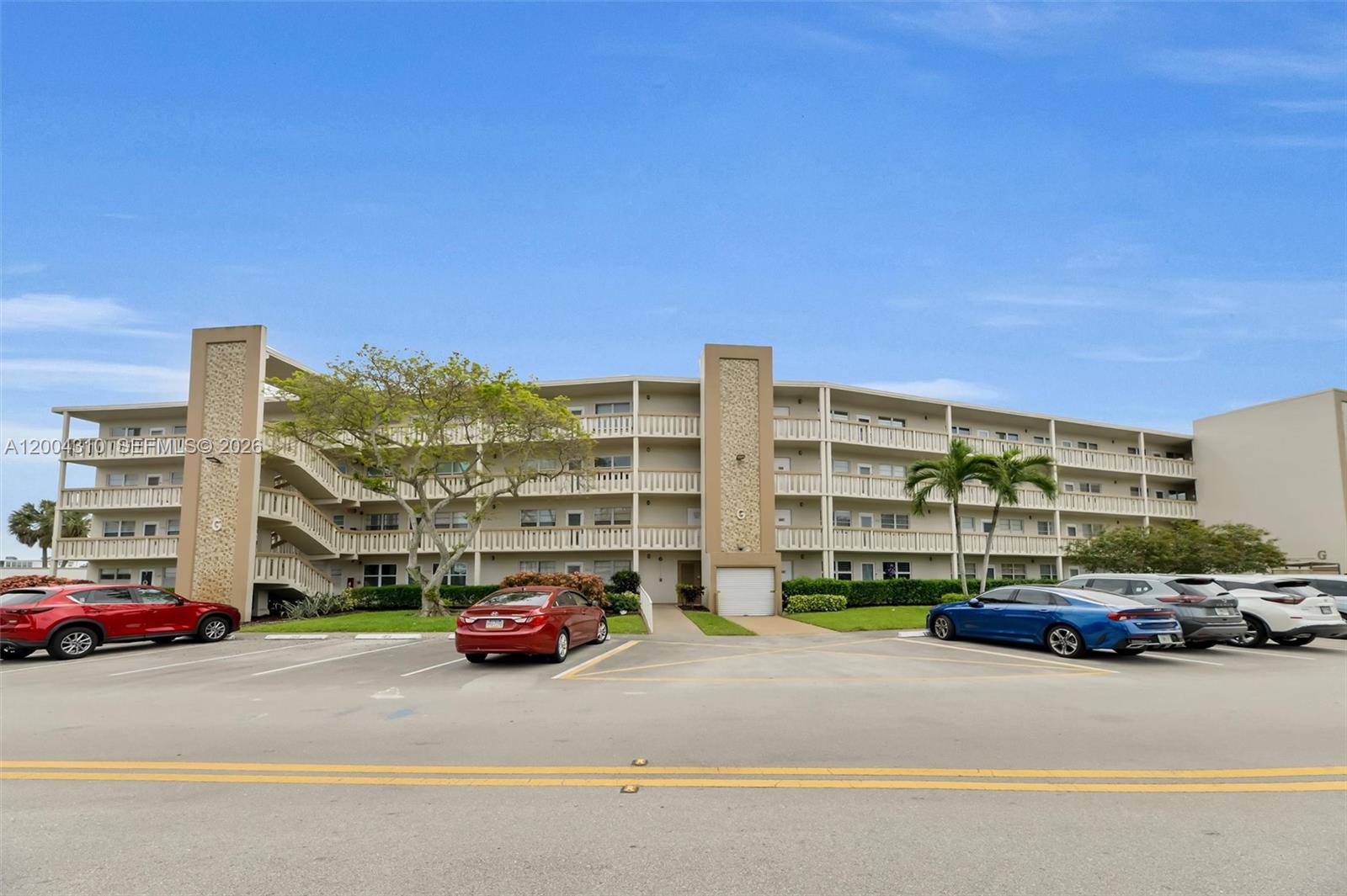 Well-maintained 2-bedroom, 2-bathroom unit in the sought-after Ventnor G building within the premier 55+ Century Village East community. This 1,000 SF residence features an updated kitchen with white shaker cabinets, granite countertops, tile backsplash, 2026 GE electric range, 2025 GE refrigerator, Samsung over-range microwave, and 2026 dishwasher. New 2025 Carrier HVAC, 2025 GE electric panel, and newer water heater. 

Front door and the two front windows are high impact. Tile floor in kitchen, carpet in living, dining and bedrooms. Ceiling fans in bedrooms. Spacious walk-in closet and interior storage. Open balcony with serene greenery views. Laundry on each floor. Ventnor G is financially sound with full reserves for roof, elevator, concrete, painting, fire, plumbing & electrical. 

Manned gate, security patrol, entry card access. CenClub amenities: pools, tennis, fitness, billiards, sauna, shuffleboard, courtesy bus. Cable, water, sewer, pest control & building insurance included in fees. 

Sold As-Is | No Pets | No Rentals | 55+ | Buyer Approval Required