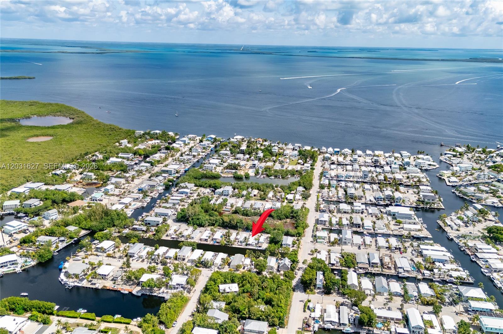 Beautifully remodeled waterfront home in the Florida Keys offering 40 feet of canal frontage and excellent investment potential. This updated property features a brand-new kitchen, new flooring, new appliances, new A/C, and washer/dryer hookup with washer and dryer included. Permanently affixed and eligible for single-family financing options (buyer to verify), the home sits on a fully fenced and gated lot with turf throughout and a private putting green. Professionally maintained and tented for termites this year, this turnkey property has strong Airbnb performance, generating approximately $4,200/month seasonally. Whether you’re looking for a vacation getaway, primary residence, or income-producing investment, this waterfront gem is a must-see.